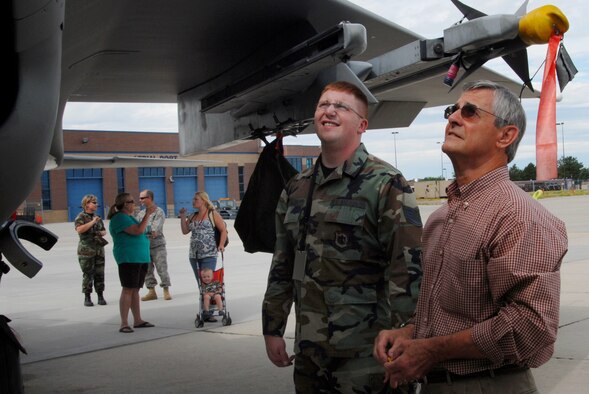 Frank Marxen, the original engineer from the 1970s of the F-15 aircraft, talks with Staff Sergeant Kyle Meserve from the 173 Fighter Wing of Oregon about the aircraft during a tour on Gowen Field Air Base on July 12, 2009. (Air Force photo by Tech Sgt Becky Vanshur)(Released)