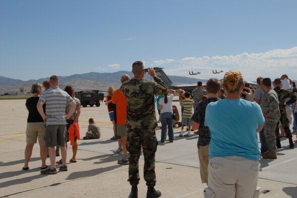 Many civilians and members of the Idaho Air and Army Guard watch two F-15 aircraft fly out of Gowen Field Air Base during a tour of an Oregon Air Guard 173 Fighter Wing aircraft on July 12, 2009. (Air Force photo by Tech Sgt Becky Vanshur)(Released)