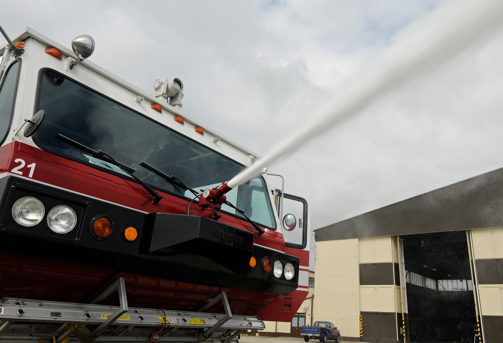 SPANGDAHLEM AIR BASE, Germany – A crash truck from the 52nd Civil Engineer Squadron sprays aqueous film-forming foam from its bumper turret on the flightline July 18. Spangdahlem AB recently replaced all AFFF with new foam uncontaminated by perfluorooctane sulfonate, a substance banned by the EU, and now must perform tests to ensure it is within specific guidelines. (U.S. Air Force photo/Senior Airman Benjamin Wilson)