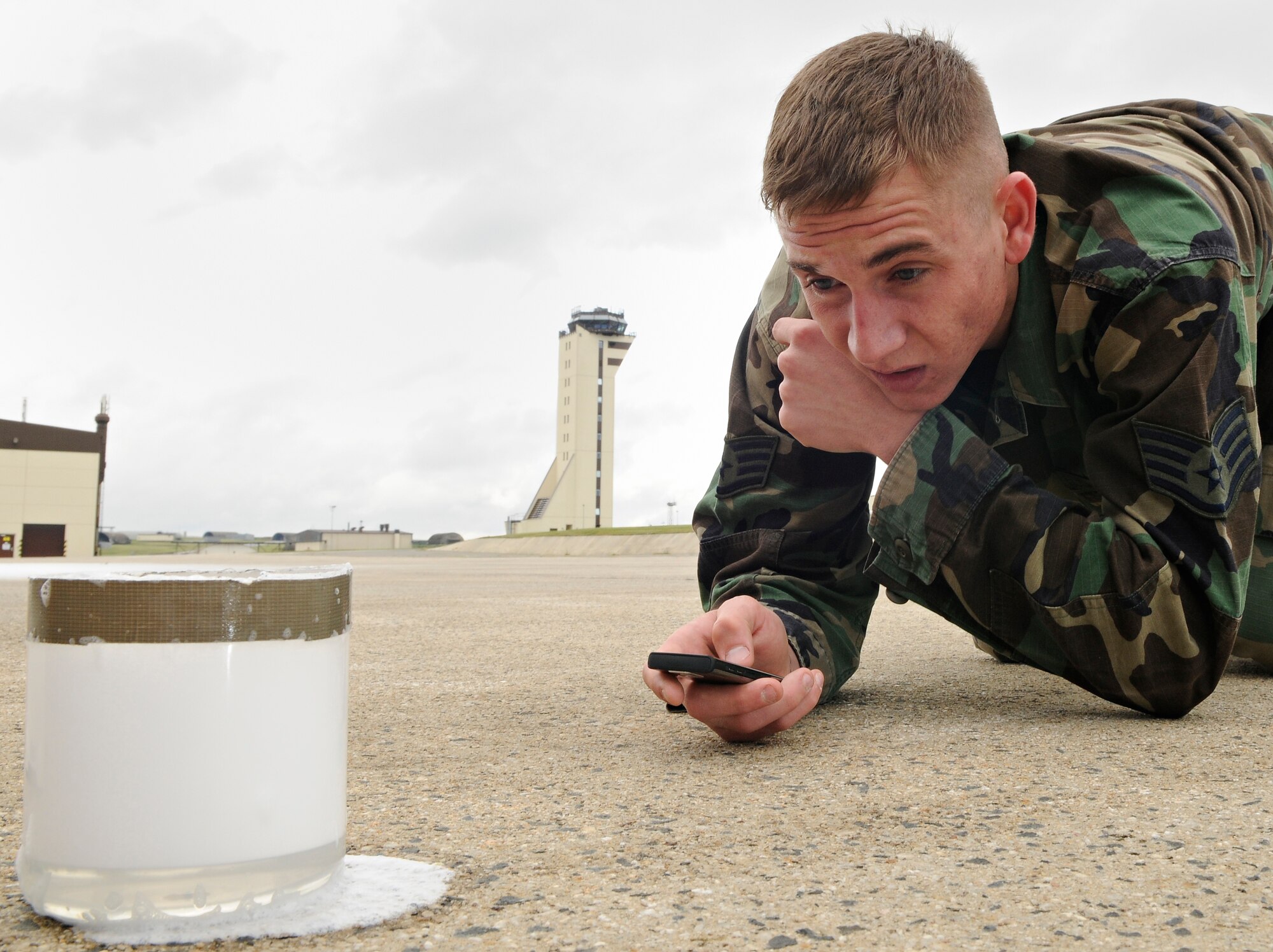SPANGDALEM AIR BASE, Germany – Staff Sgt. James Wolnik, 52nd Civil Engineer Squadron, measures how much foam settles into water in 30-second increments during a test of Spangdahlem AB’s new aqueous film-forming foam July 18. Spangdahlem AB recently replaced all AFFF with new foam uncontaminated by perfluorooctane sulfonate, a substance banned by the EU, and now must perform tests to ensure it is within specific guidelines. (U.S. Air Force photo/Senior Airman Benjamin Wilson)