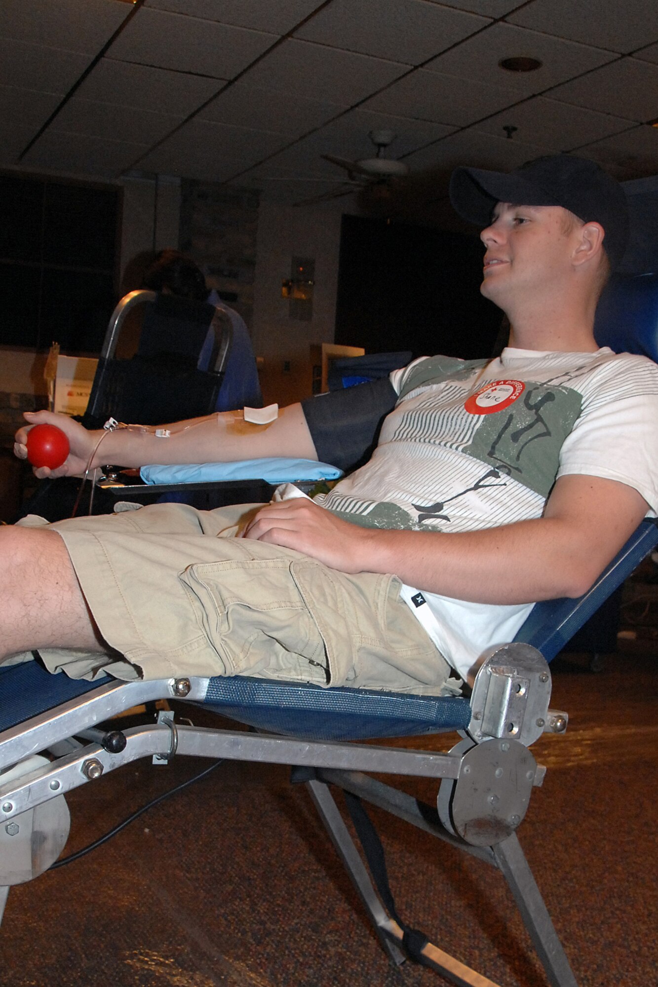 OFFUTT AIR FORCE BASE, Neb. -- Staff Sgt. Shane Starkey, 55th Maintenance Squadron, donates a double red blood cell donation during a blood drive at the Community Center here July 16. A double red cell donation, allows donors to safely donate certain components of their blood in large amounts. U.S. Air Force Photo by Kendra Williams