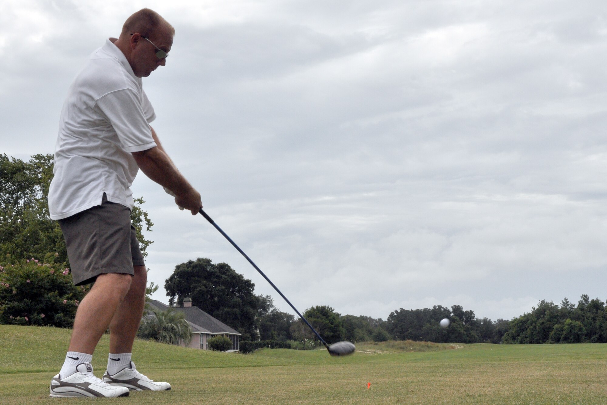 Chief Master Sgt. Anthony Shimley, 53d Wing, drives off the first tee at Shalimar Pointe Golf Course during the 53d Wing's Sword Top 4 Golf Tournament, July 17.  The tournament raised $9,250 for the Air Force Enlisted Village.  (U.S. Air Force photo/ Airman Anthony Jennings.)