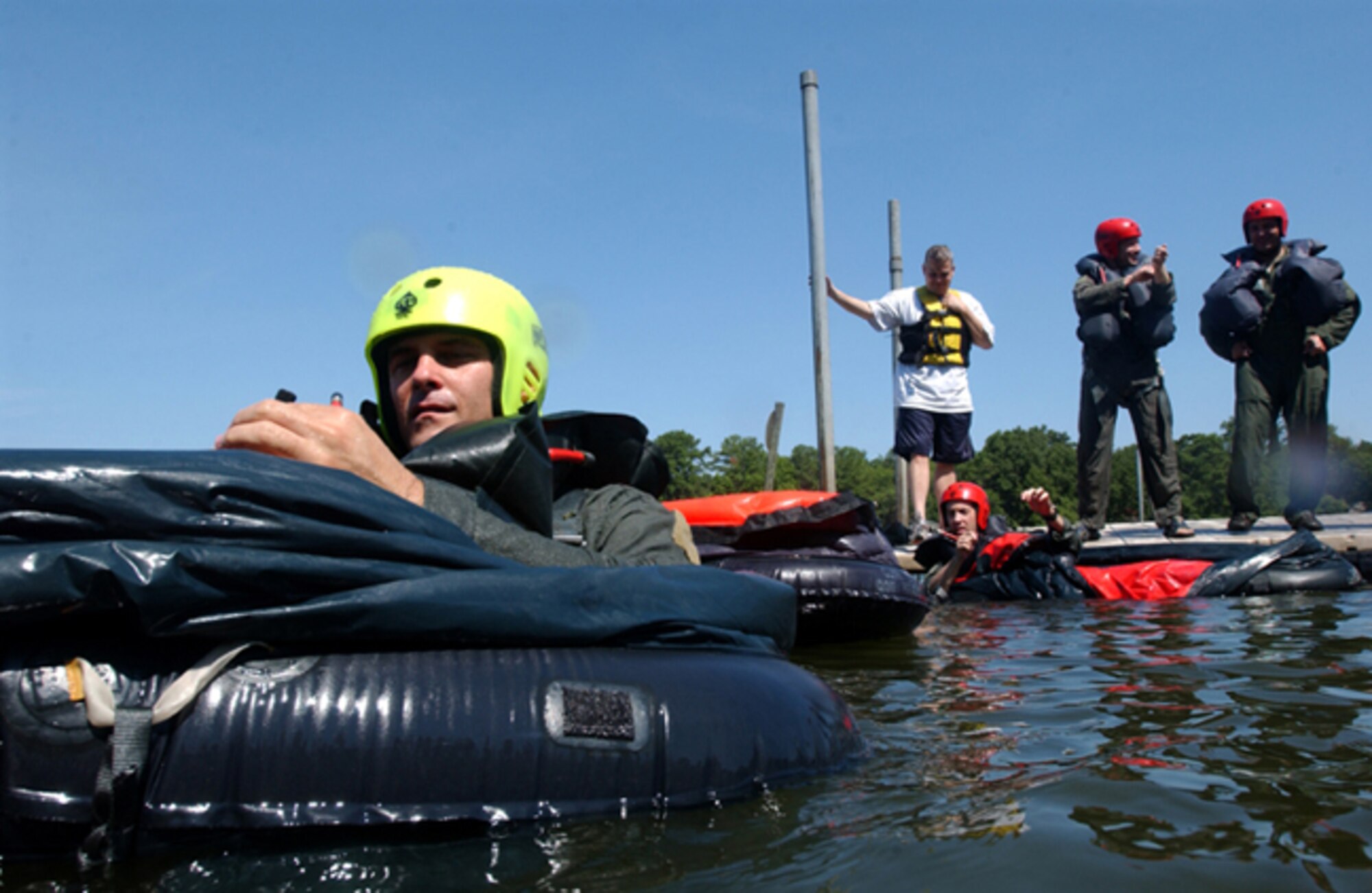 SHAW AIR FORCE BASE, S.C. -- Major Francis Rurka, 20th Operations Group,  prepares a one-man liferaft during open-ocean survival training, held by 20th Fighter Wing survival, evasion, resistance and escape specialists at Lake Wateree State Park recently. SERE specialists train aircrew and high-risk personnel on how to survive in many different scenarios.(U.S. Air Force photo/Senior Airman Matt Davis)