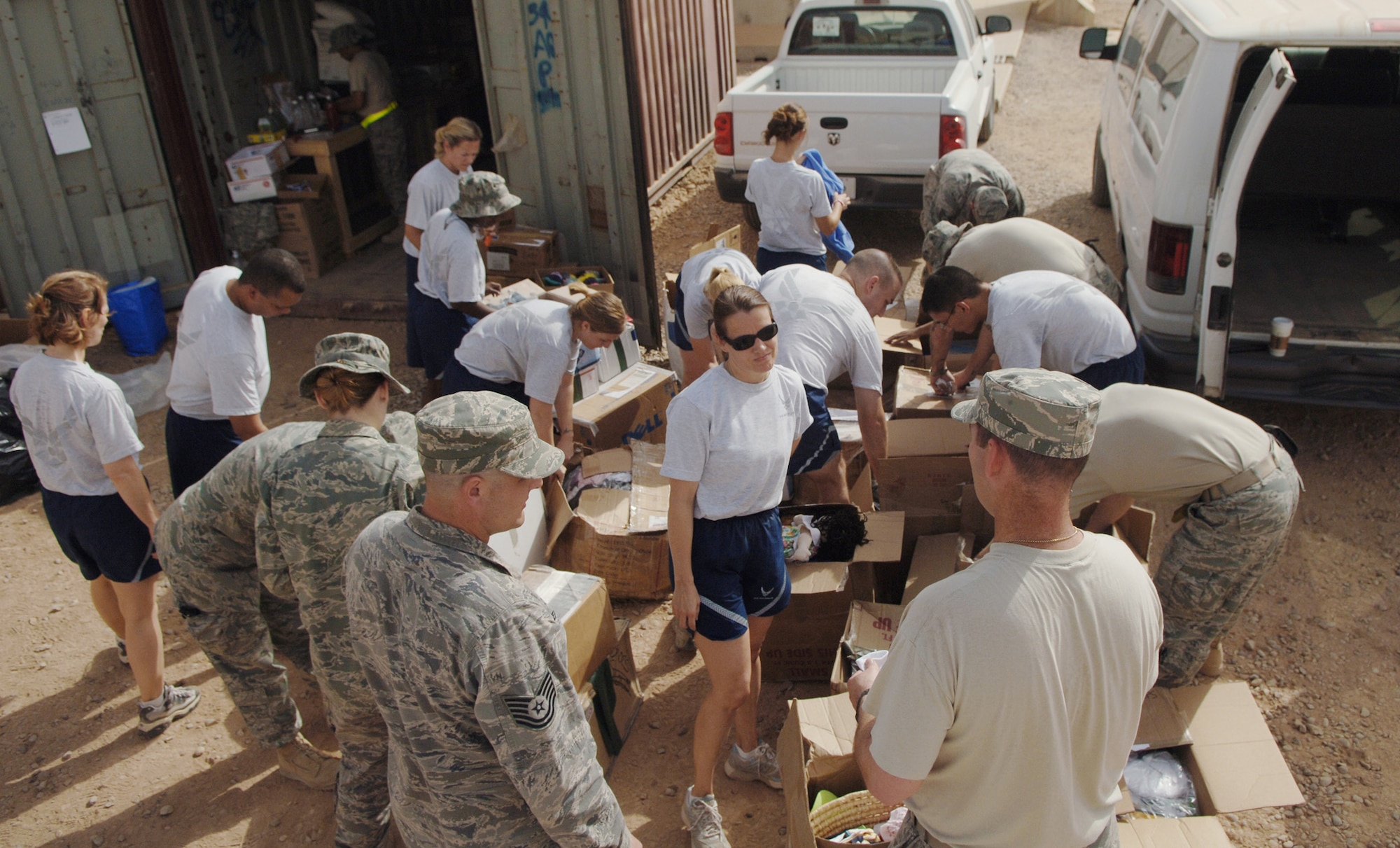 Airmen sort donations of clothing, toys and soccer balls July 15 at Joint Base Balad, Iraq. The Pennsylvania State University chapter of the Phi Kappa Tau fraternity sponsored a donation drive at a soccer tournament in June, and then shipped the balls here for distribution to children near Balad. (U.S. Air Force photo/Senior Airman Christopher Hubenthal)