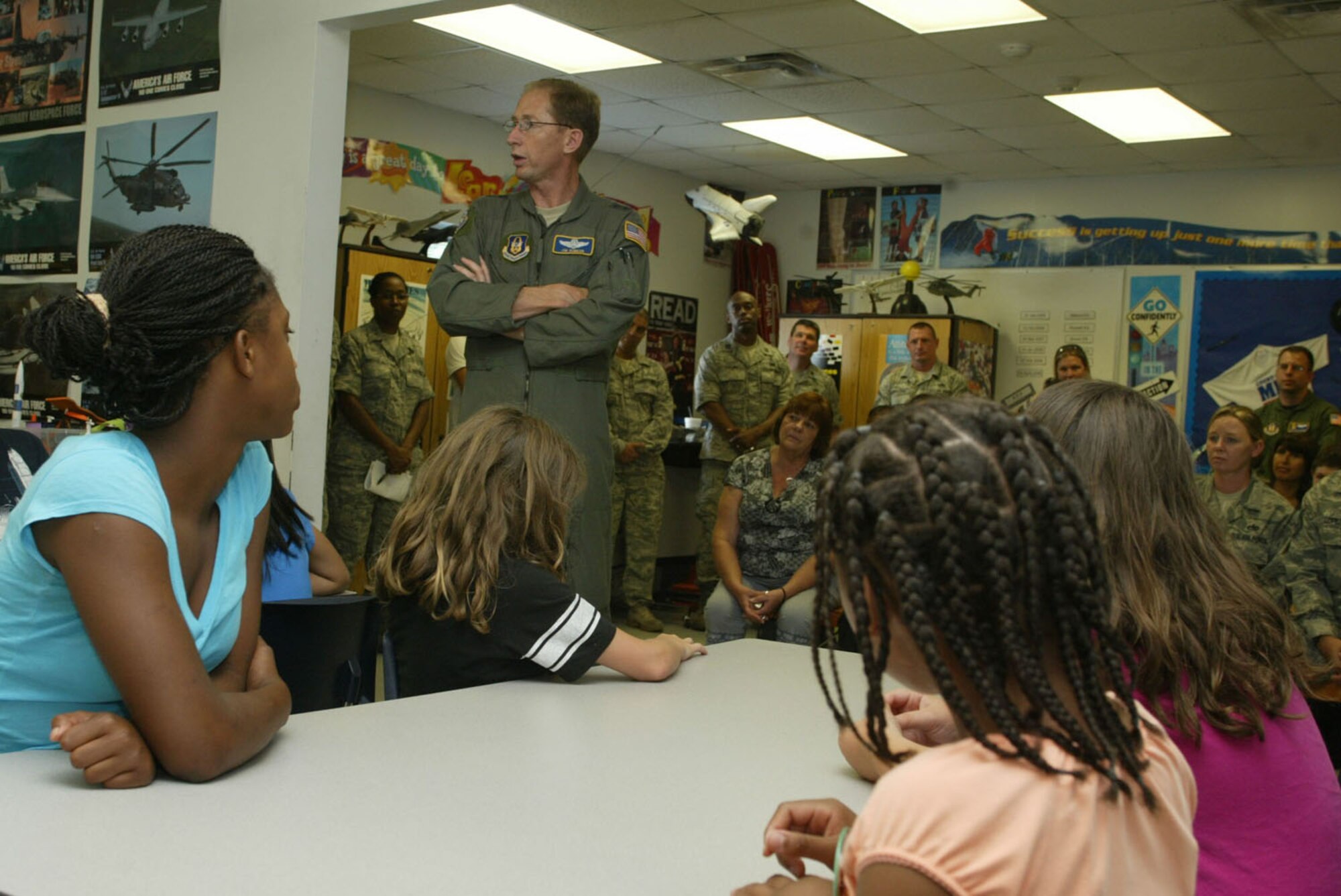 Maj. Gen. James Rubeor, 22nd Air Force commander, congratulates the STARBASE students on their successful program completion and passes on words of encouragement prior to their graduation ceremony July 16. The four-day program taught children of DoD members about science, math, technology and aviation. (U.S. Air Force photo/Don Peek)