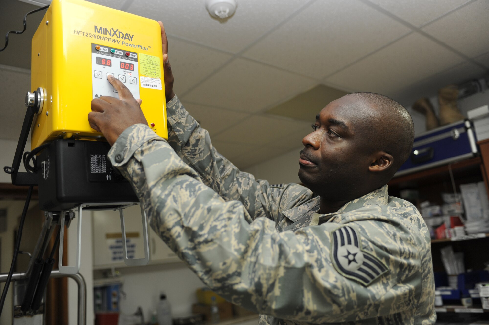 SOUTHWEST ASIA - Staff Sergeant Eric Otoo, 380th Expeditionary Medical Group, positions a portable X-ray machine for use July 17. Sergeant Otoo is working as an Aerospace Medical Services Craftsman while deployed out of Andrews Air Force Base, Md., and hails from Oklahoma City, Okla. (U.S. Air Force photo Tech. Sgt. Charles Larkin Sr)