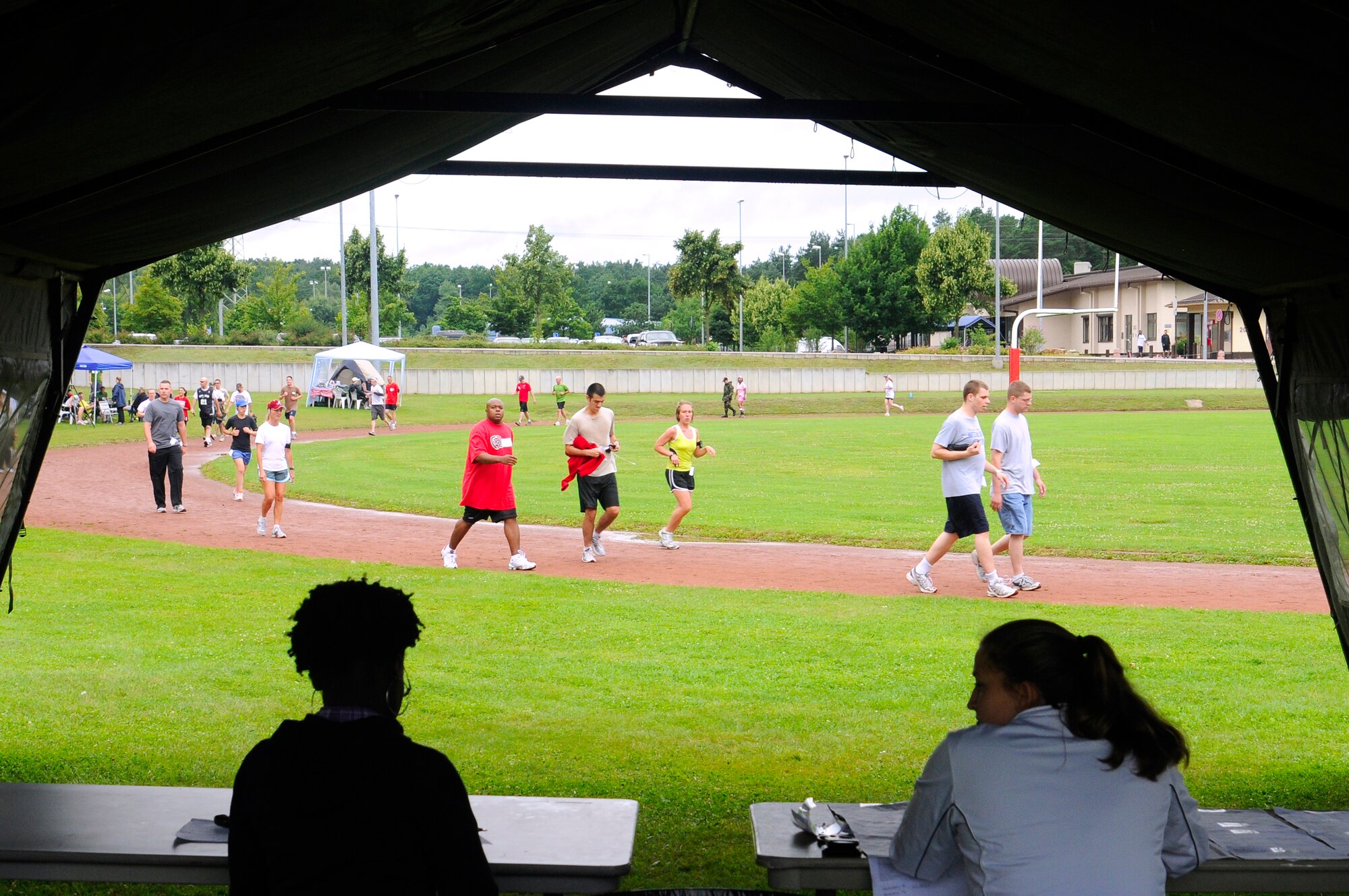 U.S. Air Force Tech. Sgt. Tamika Robinson and Airman 1st Class Tabitha Wiest, wait patiently for members to register for the Viking Challenge July 17, 2009, Vogelweh Military Complex. The Viking Challenge is an annual event that is held to raise money for the two Fisher Houses located on Landstuhl Regional Medical Center. (U.S. Air Force photo by Tech. Sgt. Kenneth Bellard)