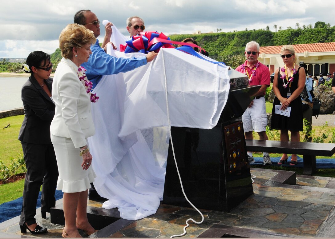 ANDERSEN AIR FORCE BASE, Guam - Madeleine Bordallo, Congressional Delegate of Guam; Joey Crisostomo, Armed Forces Committee chairman; Jim Adkins, vice civilian co-chair of the Andersen Advisory Council Executive Committee; Carmela Rapadas, 36th Wing protocol office; and First Lady Joann Camacho unveil a memorial at the Governor's Complex at Adelup Point in Hagatna, Guam, July 20. The memorial was erected at the Governor's complex so everyone both military and civilian can remember those who lost their lives in the Raider 21 crash. (U.S. Air Force photo by Senior Airman Nichelle Anderson)
