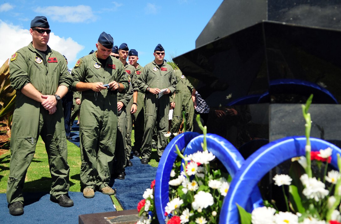 ANDERSEN AIR FORCE BASE, Guam - Members of the 20th Expeditionary Bomb Squadron pay their respects during the Raider 21 memorial unveiling ceremony at the Governor's Complex at Adelup Point in Hagatna, Guam, July 20. Family, friends and co-workers of Raider 21 along with Team Andersen and Guam community members honored the memory of the Raider 21 aircrew with a ceremony and an unveiling of a memorial dedicated to the Airmen. (U.S. Air Force photo by Airman 1st Class Courtney Witt)








