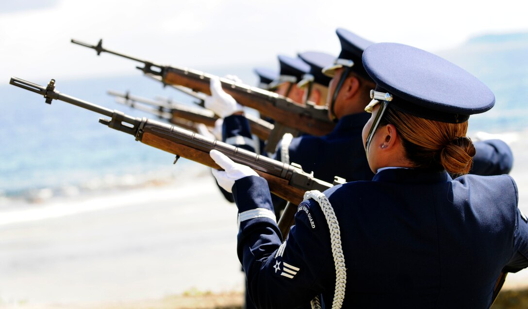 ANDERSEN AIR FORCE BASE, Guam – Airmen from the 36th Wing Honor Guard conduct a 21-gun salute during the Raider 21 memorial unveiling ceremony at the Governor's Complex at Adelup Point in Hagatna, Guam, July 20. Family, friends and co-workers of Raider 21 aircrew along with Team Andersen and Guam community members honored the fallen aircrew with a ceremony where a memorial dedicated to the Airmen was unveiled. Their aircrew died when their B-52 crashed July 21, 2008. (U.S. Air Force photo by Airman 1st Class Courtney Witt)