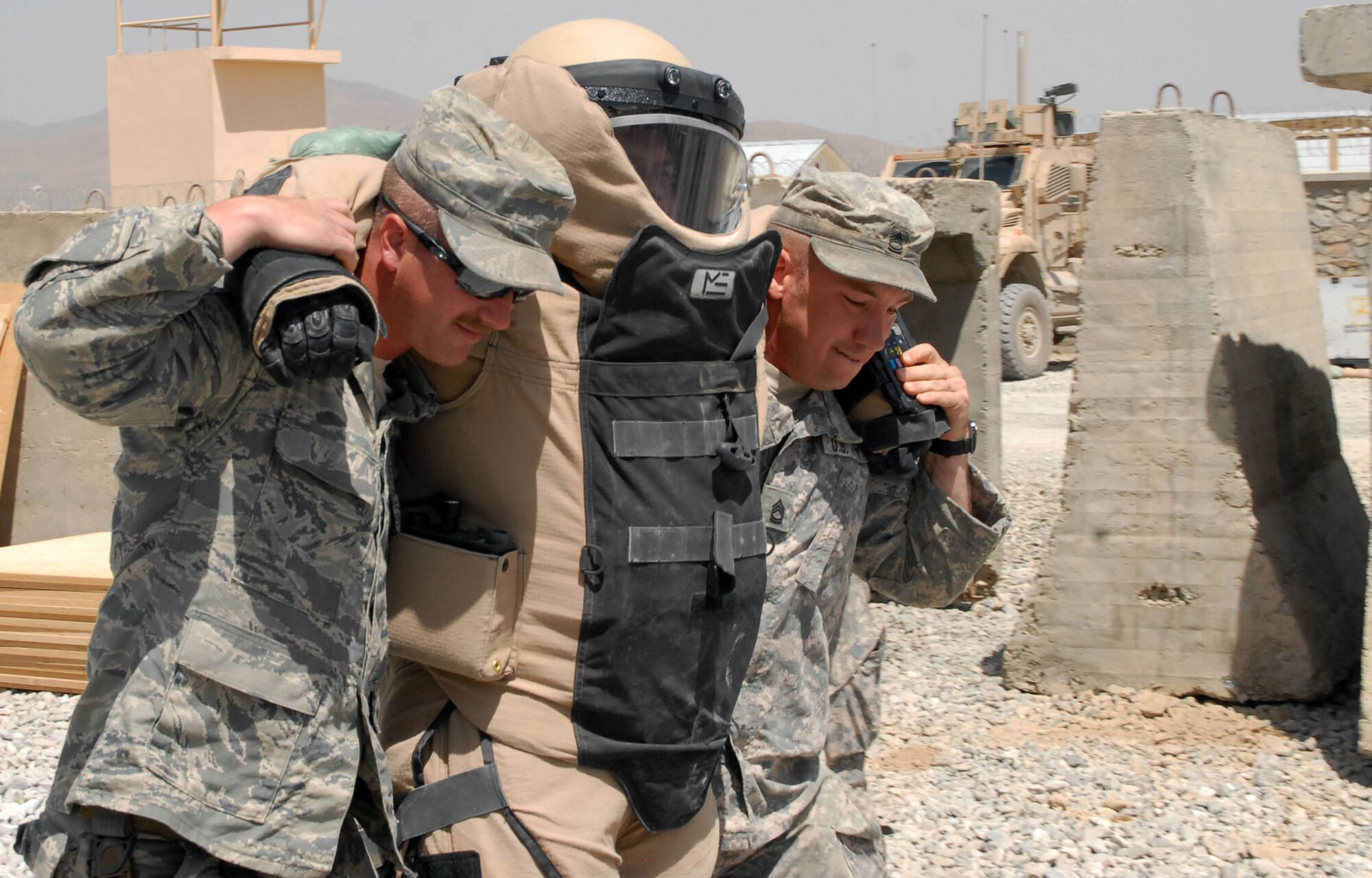 LOGAR PROVINCE, Afghanistan - Air Force Staff Sgt. Carl Dill and Army
Sgt. 1st Class Scott Lund perform a two-man carry on Air Force Tech. Sgt. Brandon Livingston during training at Forward Operating Base Shank, July 17. The
recently formed Counter Improvised Explosive Device team with 3rd Brigade,
10th Mountain Division, trains constantly to keep their skills sharp. (U.S. Army/photo by Spc. Matthew Thompson)

