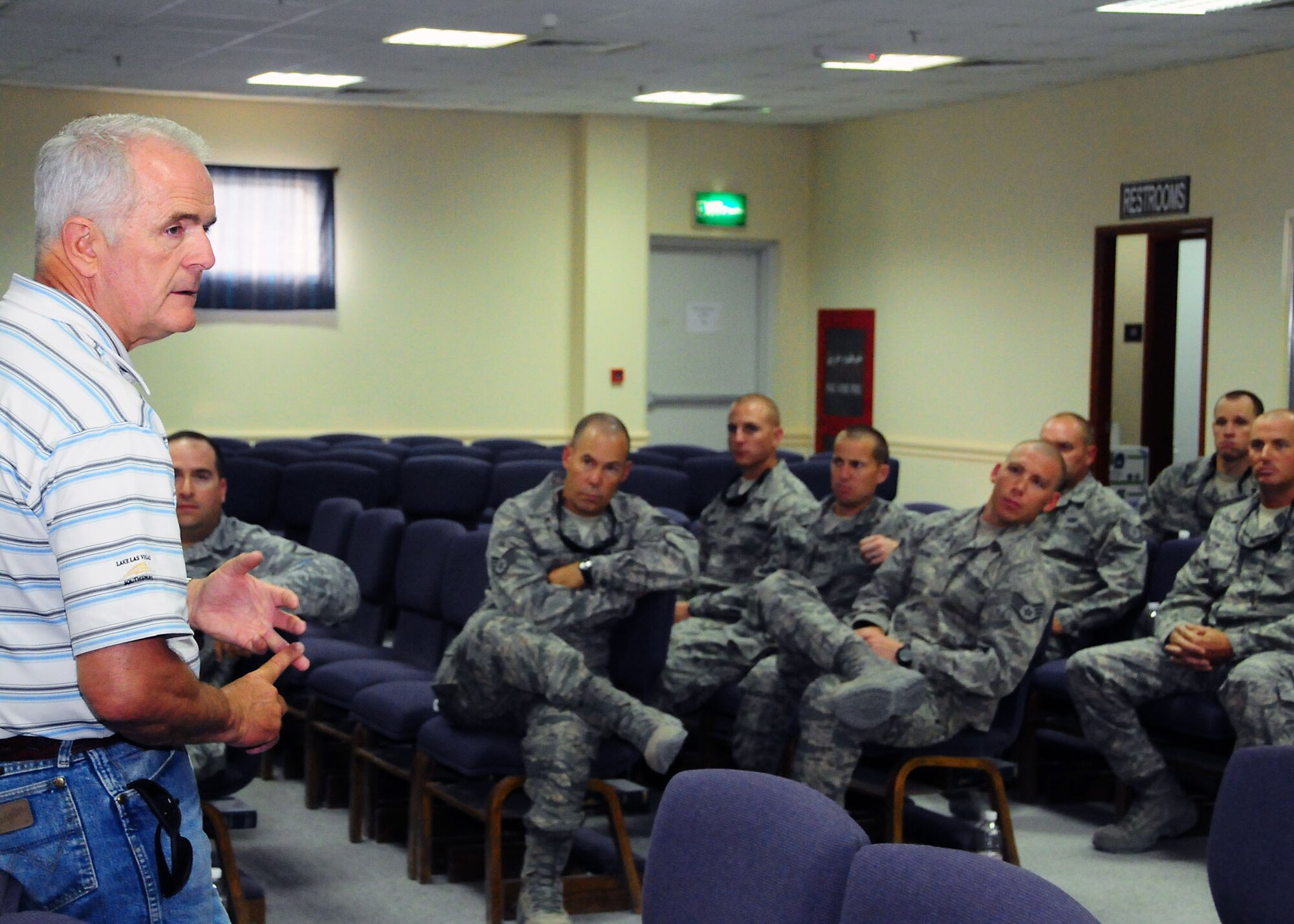 Jim Gibbons, Governor, State of Nev. (R), speaks to members of the 386th Air Expeditionary Wing during a townhall meeting held at an undisclosed location in Southwest Asia July 19.  Governors from the states of Texas, Minnesota, Nevada, Missouri, and Illinois were on tour visiting troops from around the AOR, political constituents and military leadership.  (U.S. Air Force photo/Tech Sgt. Tony Tolley)