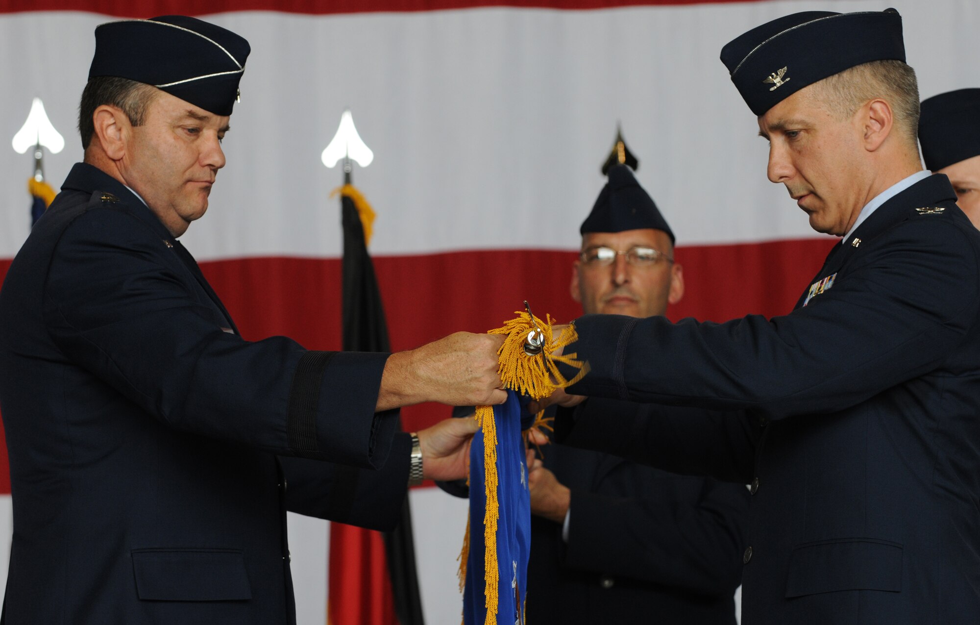 U.S. Air Force Col. Thomas F. Gould, 435th Air Ground Operations Wing commander, right, and U.S. Air Force Lt. Gen. Philip M. Breedlove, 3rd Air Force commander, unveil the 435th AGOW guidon during the 435th Air Base Wing redesignation ceremony, Ramstein Air Base, Germany, July 16, 2009. During the ceremony, the 435th ABW was redesignated to the 435th AGOW, the first of its kind in U.S. Air Forces in Europe. (U.S. Air Force photo by Senior Airman Nathan Lipscomb)