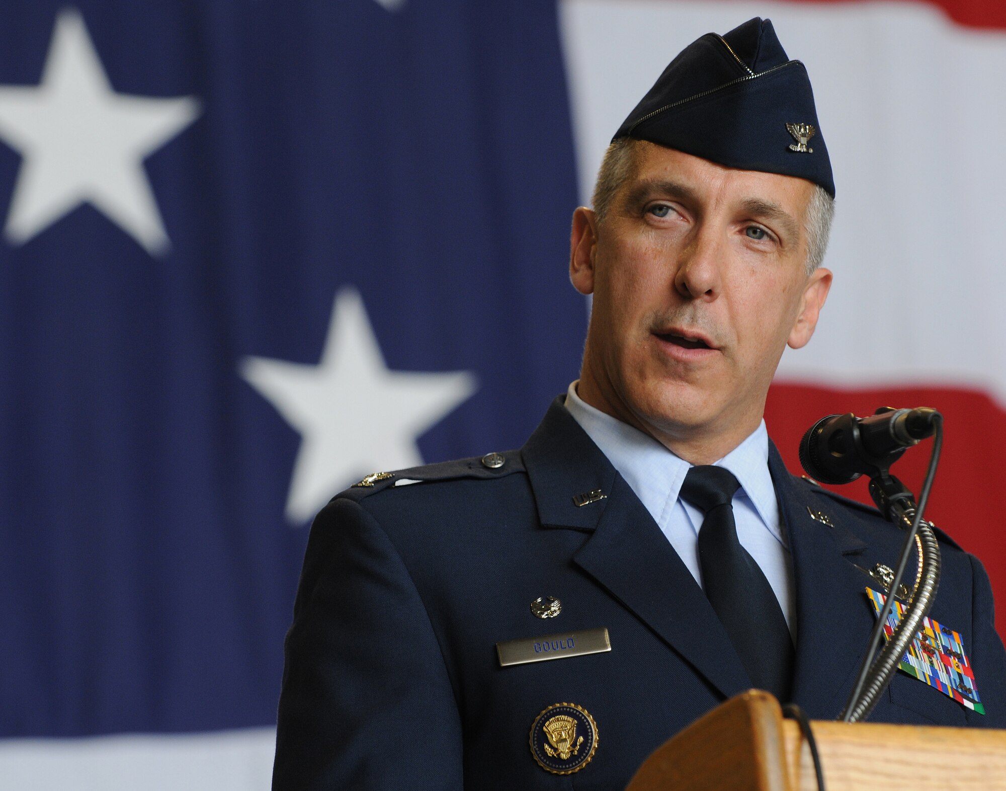 U.S. Air Force Col. Thomas F. Gould, 435th Air Ground Operations Wing commander, addresses the crowd during the 435th Air Base Wing redesignation ceremony, Ramstein Air Base, Germany, July 16, 2009. During the ceremony, the 435th ABW was redesignated to the 435th AGOW, the first of its kind in U.S. Air Forces in Europe. (U.S. Air Force photo by Senior Airman Nathan Lipscomb)