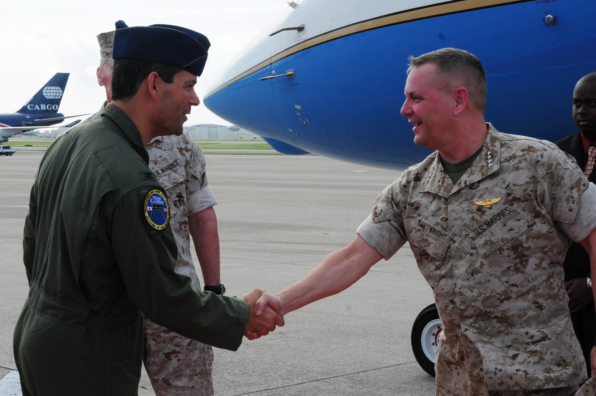 Colonel Kenneth Wilsbach, 18th Wing commander, welcomes Gen James Cartwright, Vice Chairman of the Joint Chiefs of Staff, to Kadena Air Base July 21. Gen Cartwright is visiting Okinawa for the PAC 3 initiatives Marine realignment.