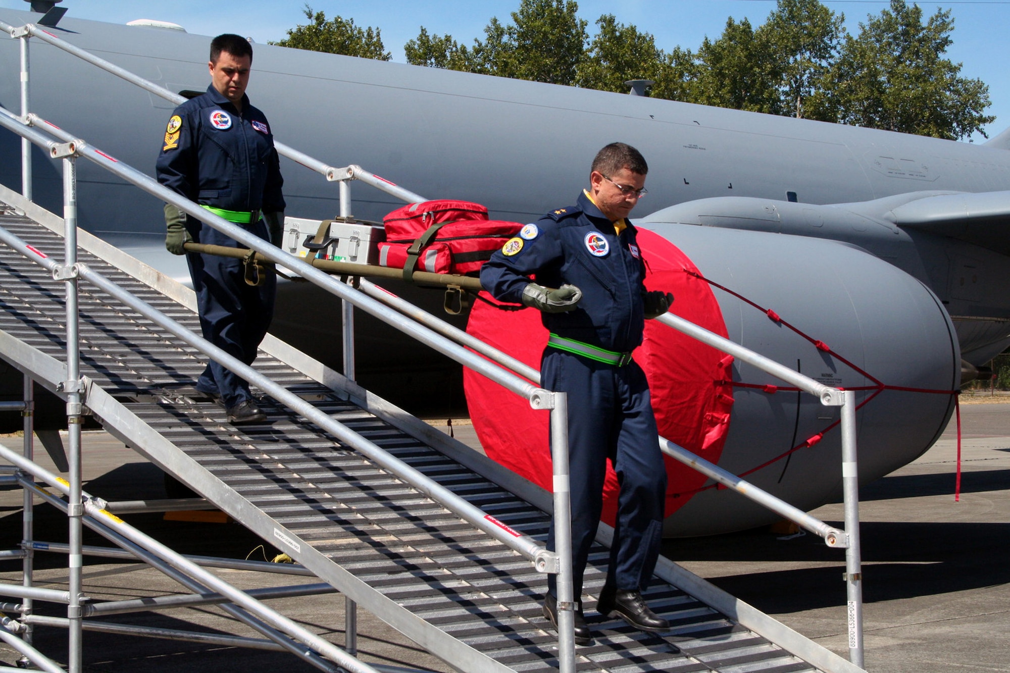 Turkish team members carry a gurney down the Patient Loading System ramp during aeromedical evacuation events for Air Mobility RODEO 2009 at McChord Air Force Base, Wash., July 20, 2009. More than 100 teams are participating in RODEO competition, including teams from seven foreign countries. RODEO is the U.S. Air Force's and AMC's premier air mobility competition. It's an international combat skills and flying operations competition designed to develop and improve techniques, procedures and interoperability with international partners to optimize mobility partnerships and enhance mobility operations. (U.S. Air Force Photo/Tech. Sgt. Scott T. Sturkol)