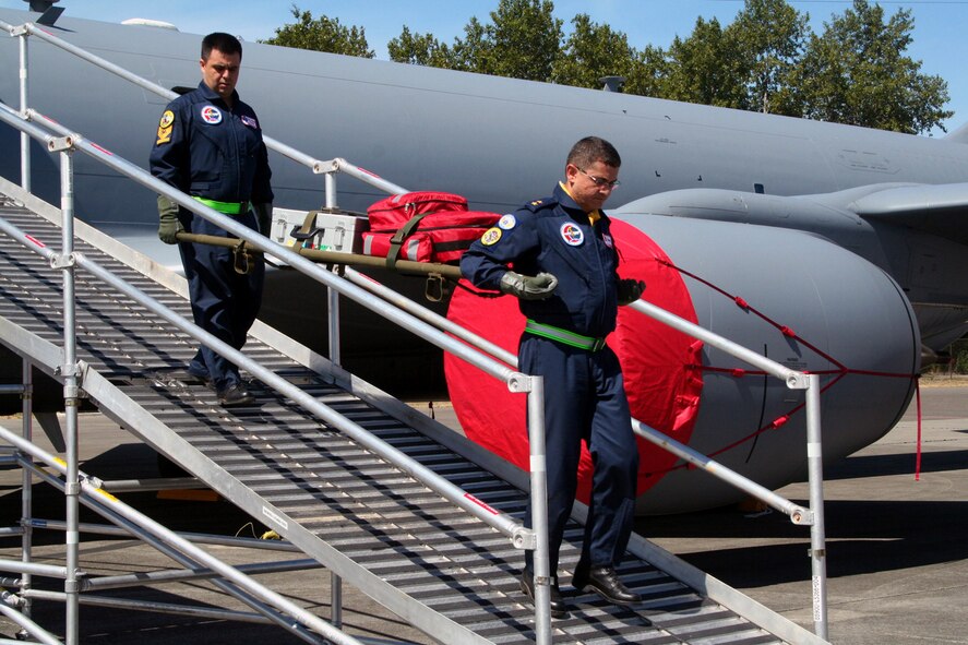Turkish team members carry a gurney down the Patient Loading System ramp during aeromedical evacuation events for Air Mobility RODEO 2009 at McChord Air Force Base, Wash., July 20, 2009. More than 100 teams are participating in RODEO competition, including teams from seven foreign countries. RODEO is the U.S. Air Force's and AMC's premier air mobility competition. It's an international combat skills and flying operations competition designed to develop and improve techniques, procedures and interoperability with international partners to optimize mobility partnerships and enhance mobility operations. (U.S. Air Force Photo/Tech. Sgt. Scott T. Sturkol)