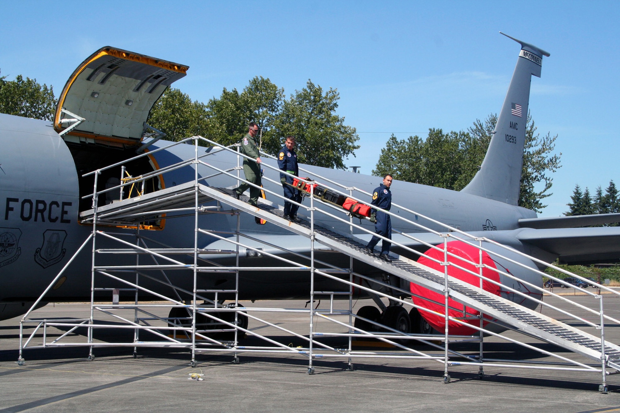 Turkish team members carry a gurney down the Patient Loading System ramp during aeromedical evacuation events for Air Mobility RODEO 2009 at McChord Air Force Base, Wash., July 20, 2009. More than 100 teams are participating in RODEO competition, including teams from seven foreign countries. RODEO is the U.S. Air Force's and AMC's premier air mobility competition. It's an international combat skills and flying operations competition designed to develop and improve techniques, procedures and interoperability with international partners to optimize mobility partnerships and enhance mobility operations. (U.S. Air Force Photo/Tech. Sgt. Scott T. Sturkol)