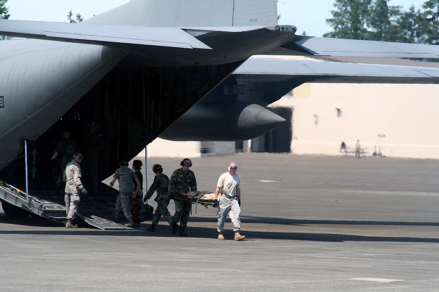 Teams compete in the aeromedical evacuation events for Air Mobility RODEO 2009 at McChord Air Force Base, Wash., July 20, 2009. More than 100 teams are participating in RODEO competition, including teams from seven foreign countries. RODEO is the U.S. Air Force's and AMC's premier air mobility competition. It's an international combat skills and flying operations competition designed to develop and improve techniques, procedures and interoperability with international partners to optimize mobility partnerships and enhance mobility operations. (U.S. Air Force Photo/Tech. Sgt. Scott T. Sturkol)