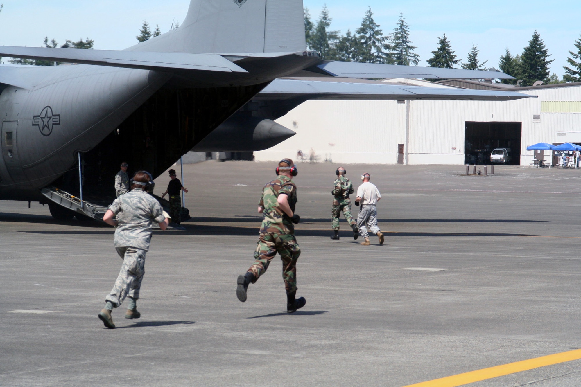 Teams compete in the aeromedical evacuation events for Air Mobility RODEO 2009 at McChord Air Force Base, Wash., July 20, 2009. More than 100 teams are participating in RODEO competition, including teams from seven foreign countries. RODEO is the U.S. Air Force's and AMC's premier air mobility competition. It's an international combat skills and flying operations competition designed to develop and improve techniques, procedures and interoperability with international partners to optimize mobility partnerships and enhance mobility operations. (U.S. Air Force Photo/Tech. Sgt. Scott T. Sturkol)