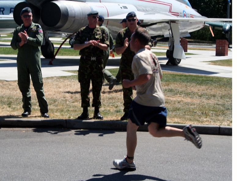 International competitors cheer on participants in the fit-to-fight competition for Air Mobility Command's RODEO 2009 July 19 at McChord Air Force Base, Wash.  More than 100 teams are participating in RODEO competition, including teams from seven foreign countries. RODEO is the U.S. Air Force's and AMC's premier air mobility competition. It's an international combat skills and flying operations competition designed to develop and improve techniques, procedures and interoperability with international partners to optimize mobility partnerships and enhance mobility operations. (U.S. Air Force Photo/Tech. Sgt. Scott T. Sturkol)