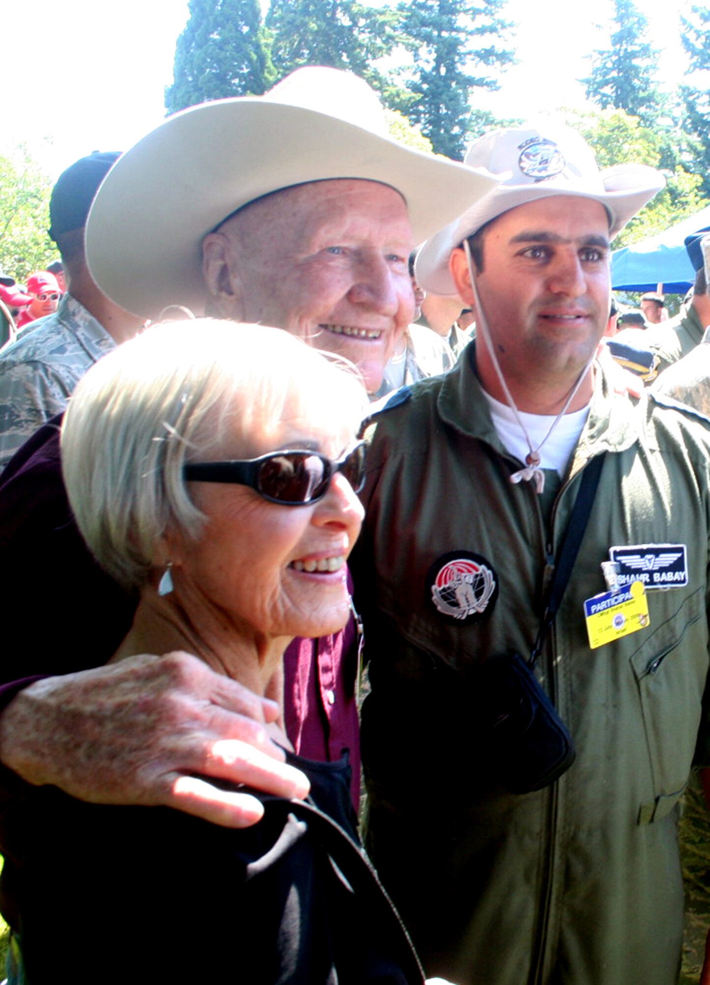 Retired Col. Gail Halvorson (center), also known as the "Candy Bomber" for his participation in the Berlin Airlift in 1947, greets with international competitors during Air Mobility Command's RODEO 2009 July 19 at McChord Air Force Base, Wash.  More than 100 teams are participating in RODEO competition, including teams from seven foreign countries. RODEO is the U.S. Air Force's and AMC's premier air mobility competition. It's an international combat skills and flying operations competition designed to develop and improve techniques, procedures and interoperability with international partners to optimize mobility partnerships and enhance mobility operations. (U.S. Air Force Photo/Tech. Sgt. Scott T. Sturkol)