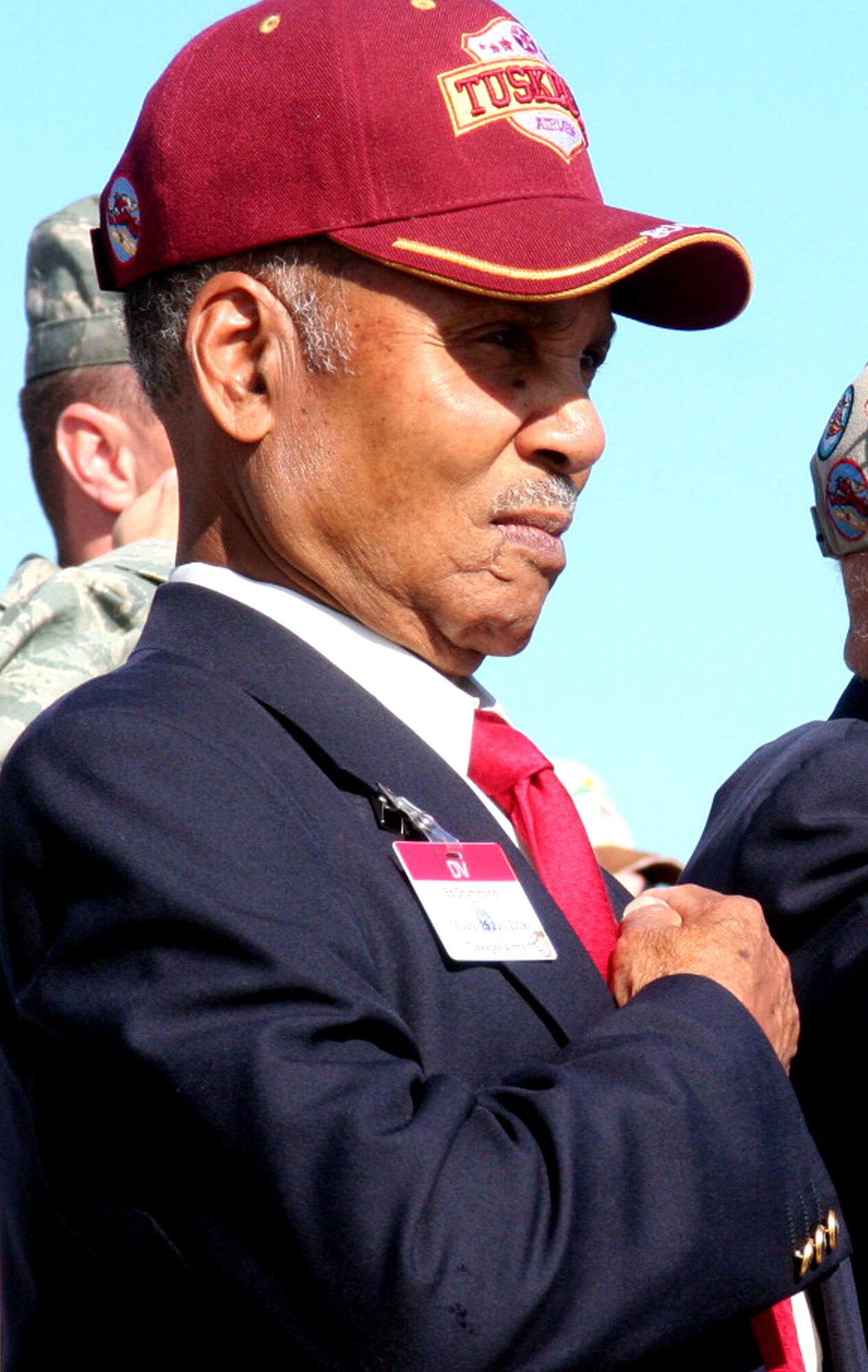 Retired Lt. Col. Edward Drummond Jr., one of the original Tuskegee Airmen, observes the playing of the national anthem during opening ceremonies for Air Mobility RODEO 2009 July 19 at McChord Air Force Base, Wash.  Colonel Drummond visited RODEO as a distinguished visitor.  He retired from the Air Force in 1970 after 25 years of service and resides in Washington state.  (U.S. Air Force Photo/Tech. Sgt. Scott T. Sturkol)