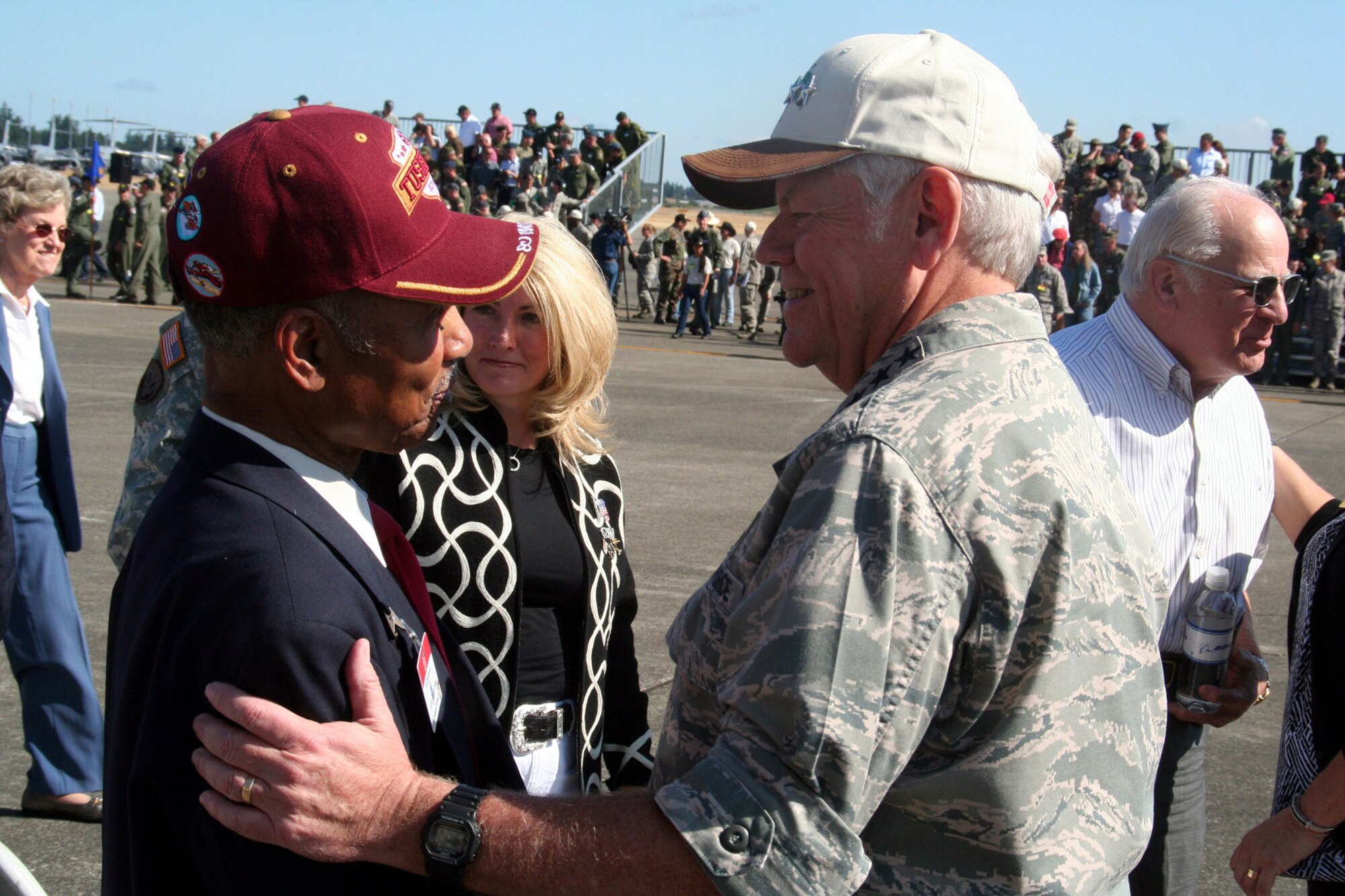 Gen. Arthur J. Lichte, Air Mobility Command commander, greets one of the original Tuskegee Airmen, retired Lt. Col. Edward Drummond Jr., after completion of opening ceremonies for Air Mobility RODEO 2009.  Colonel Drummond retired from the Air Force in 1970 and resides in Washington state. (U.S. Air Force Photo/Tech. Sgt. Scott T. Sturkol)
