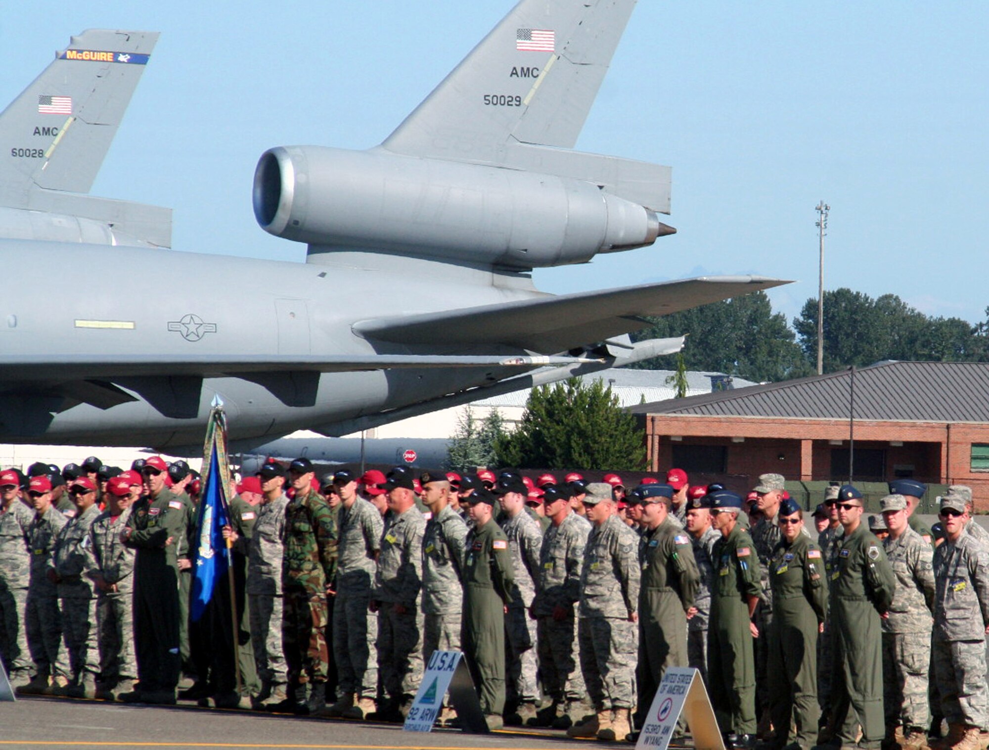 Teams stand in formation for opening ceremonies for Air Mobility Command's RODEO 2009 July 19 at McChord Air Force Base, Wash.  More than 100 teams are participating in RODEO competition, including teams from seven foreign countries. RODEO is the U.S. Air Force's and AMC's premier air mobility competition. It's an international combat skills and flying operations competition designed to develop and improve techniques, procedures and interoperability with international partners to optimize mobility partnerships and enhance mobility operations. (U.S. Air Force Photo/Tech. Sgt. Scott T. Sturkol)
