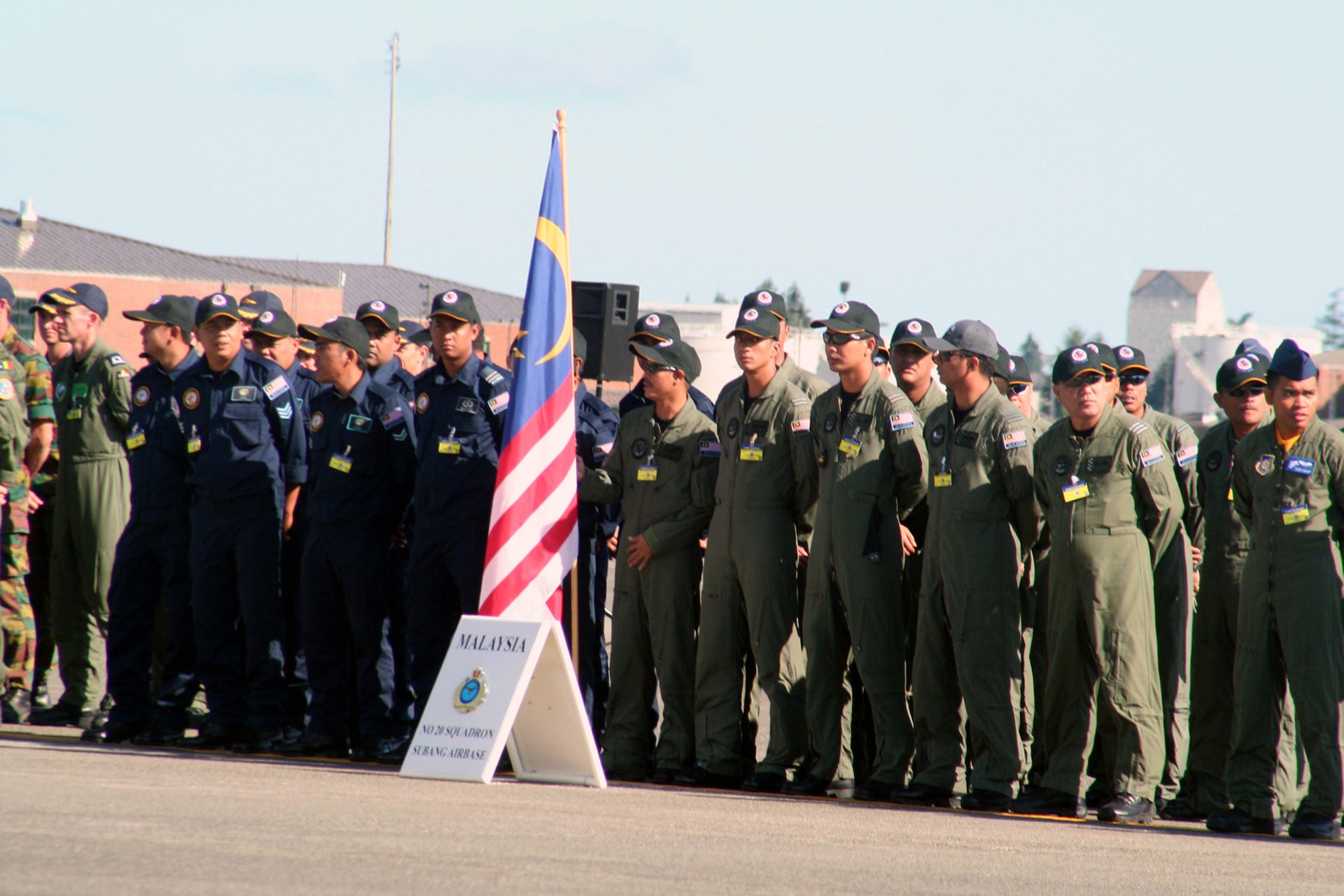 Members of the Malaysian team prepare for opening ceremonies for Air Mobility Command's RODEO 2009 July 19 at McChord Air Force Base, Wash.  More than 100 teams are participating in RODEO competition, including teams from seven foreign countries. RODEO is the U.S. Air Force's and AMC's premier air mobility competition. It's an international combat skills and flying operations competition designed to develop and improve techniques, procedures and interoperability with international partners to optimize mobility partnerships and enhance mobility operations. (U.S. Air Force Photo/Tech. Sgt. Scott T. Sturkol)