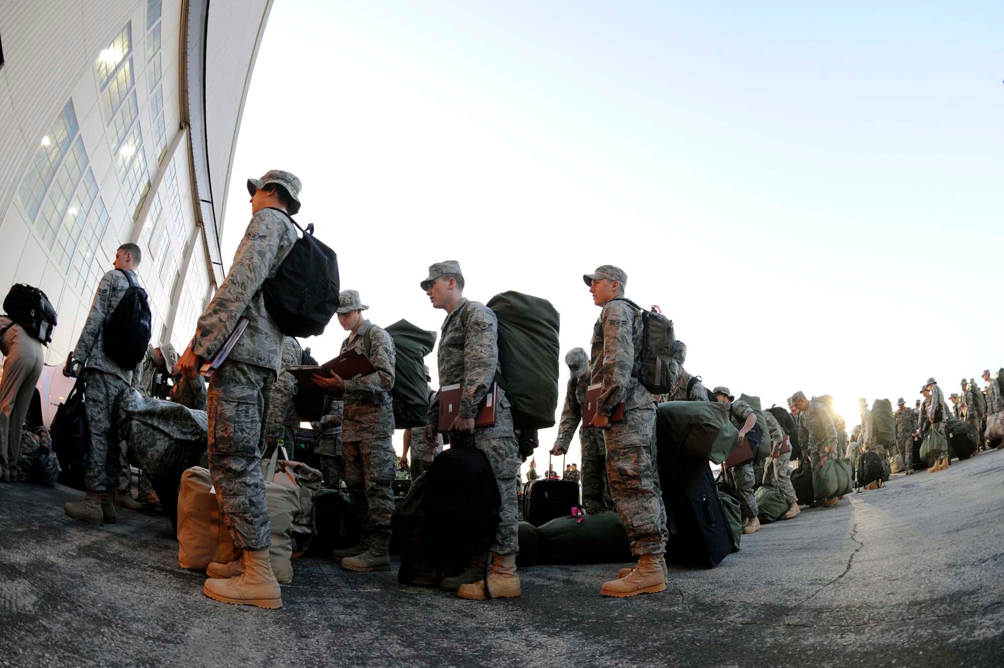 Members of the 28th Bomb Wing prepare to initially in-process and check their luggage before deploying July 21. The Airmen deployed to Southwest Asia in support of B-1 operations and personnel. (U.S. Air Force photo by Airman 1st Class Corey Hook)