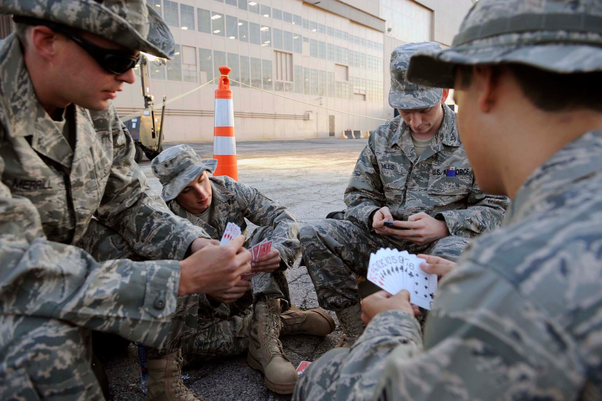 Airmen of the 28th Bomb Wing play a game of cards before deploying July 21. Airmen representing various specialties deployed in support of operations at the 379th Air Expeditionary Wing in Southwest Asia. (U.S. Air Force photo by Airman 1st Class Corey Hook)