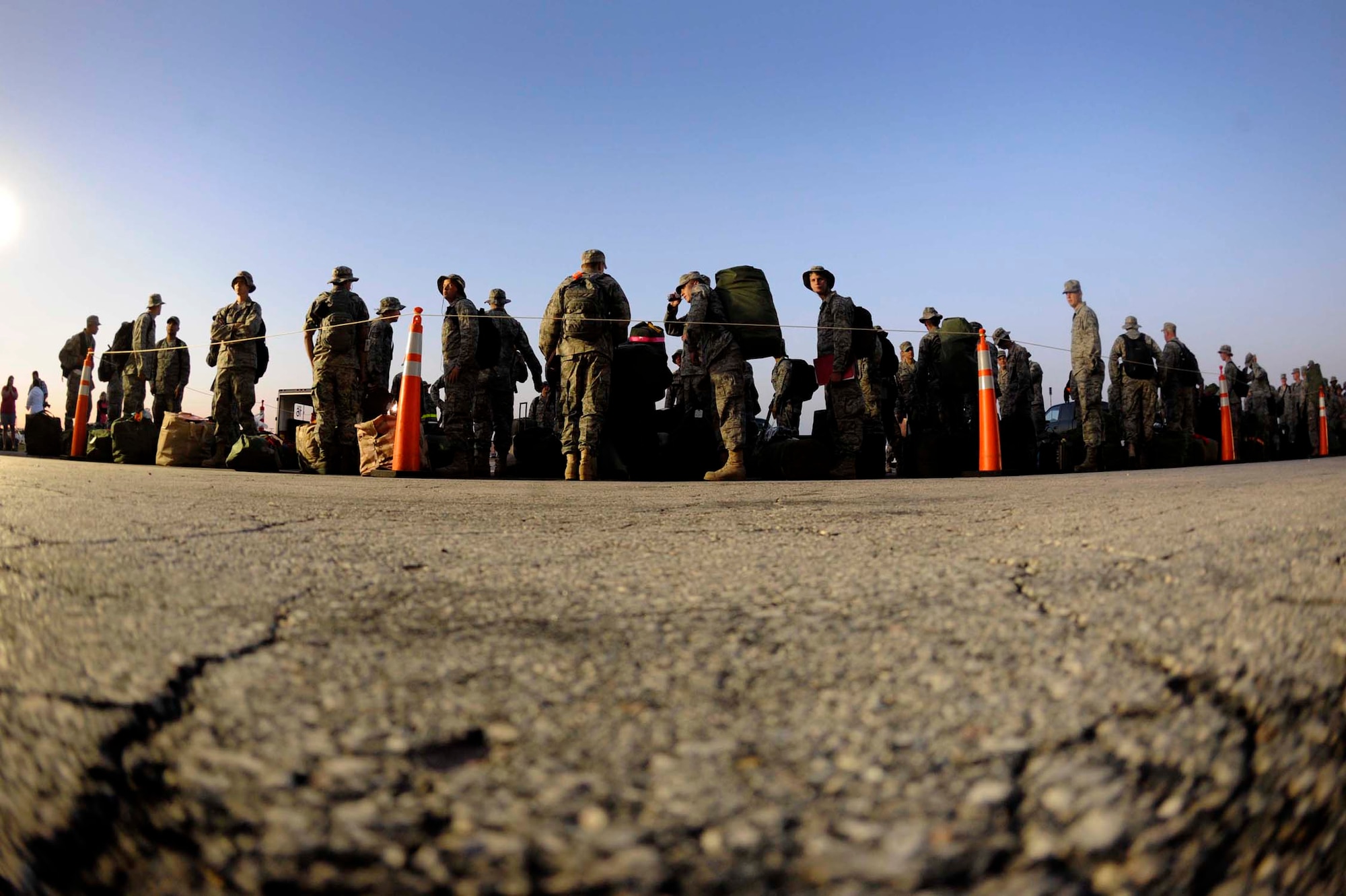 Members of the 28th Bomb Wing prepare to initially in-process and check their luggage before deploying July 21. Ellsworth Airmen in various roles deployed in support of operations at the 379th Air Expeditionary Wing in Southwest Asia. (U.S. Air Force photo by Airman 1st Class Corey Hook)