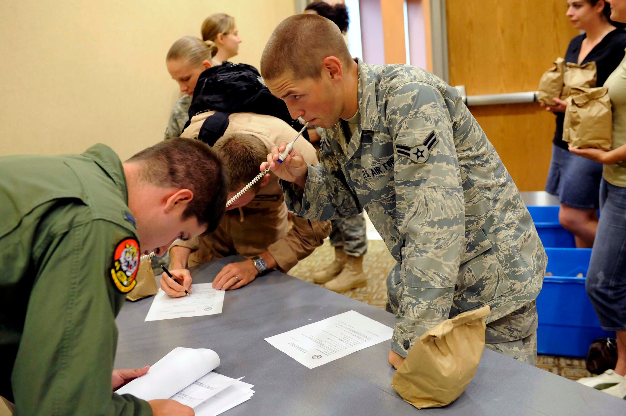 Airman 1st Class Zachary Aichele, 28th Operations Support Squadron radio communications journeyman, gets medically screened before deploying July 21.The Airmen deployed to Southwest Asia to support B-1 operations and personnel. (U.S. Air Force photo by Airman 1st Class Corey Hook)