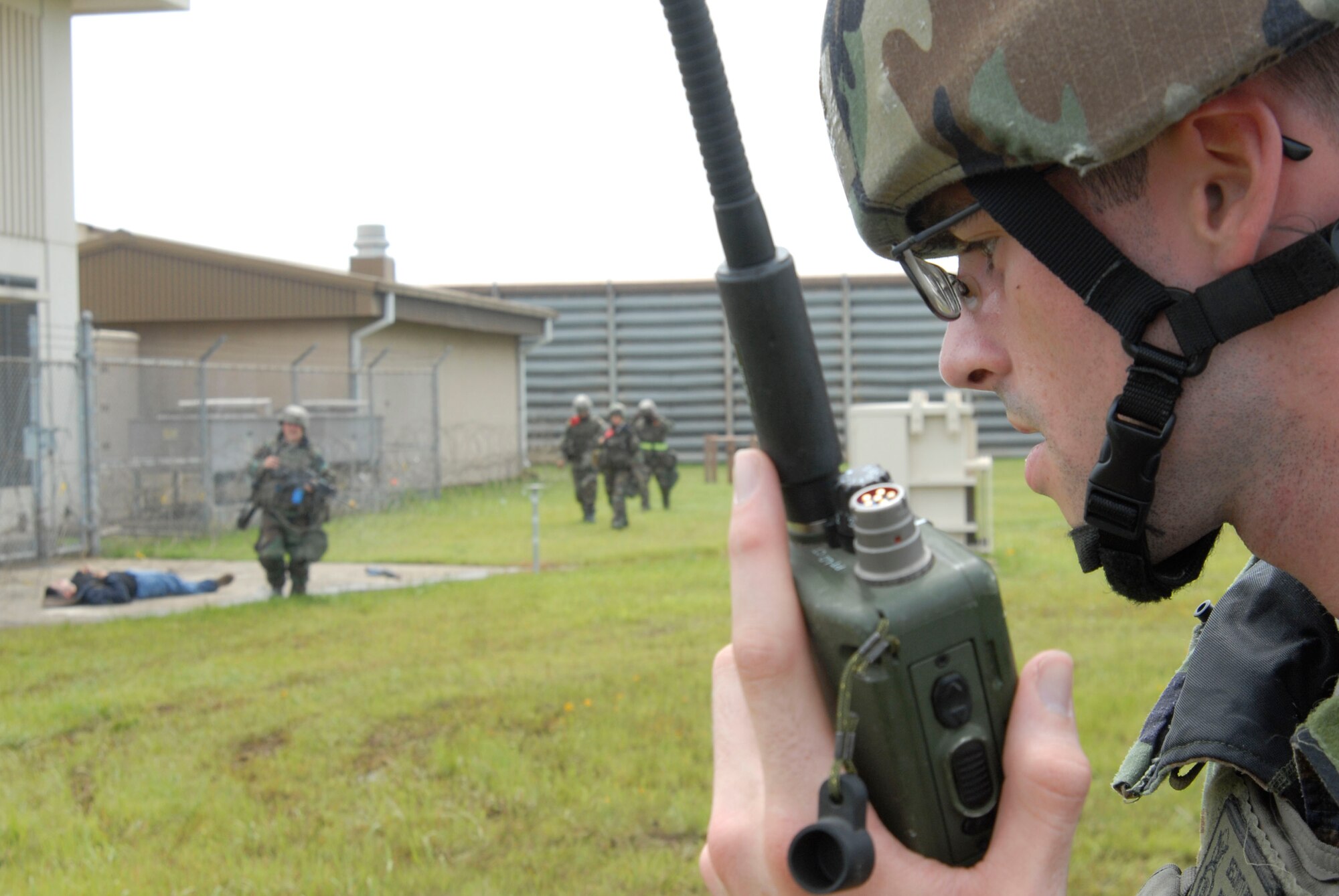 Airman 1st Class Joshua Russell, assigned to the 8th Security Forces Squadron, reports the status of his fellow SFS members and the enemy personnel after a simulated  ground attack to the control tower July 21, at Kunsan Air Base, Republic of Korea. This Airmen is participating in a peninsula wide operational readiness exercise. (U.S. Air Force photo/Staff Sgt. Darnell T. Cannady)