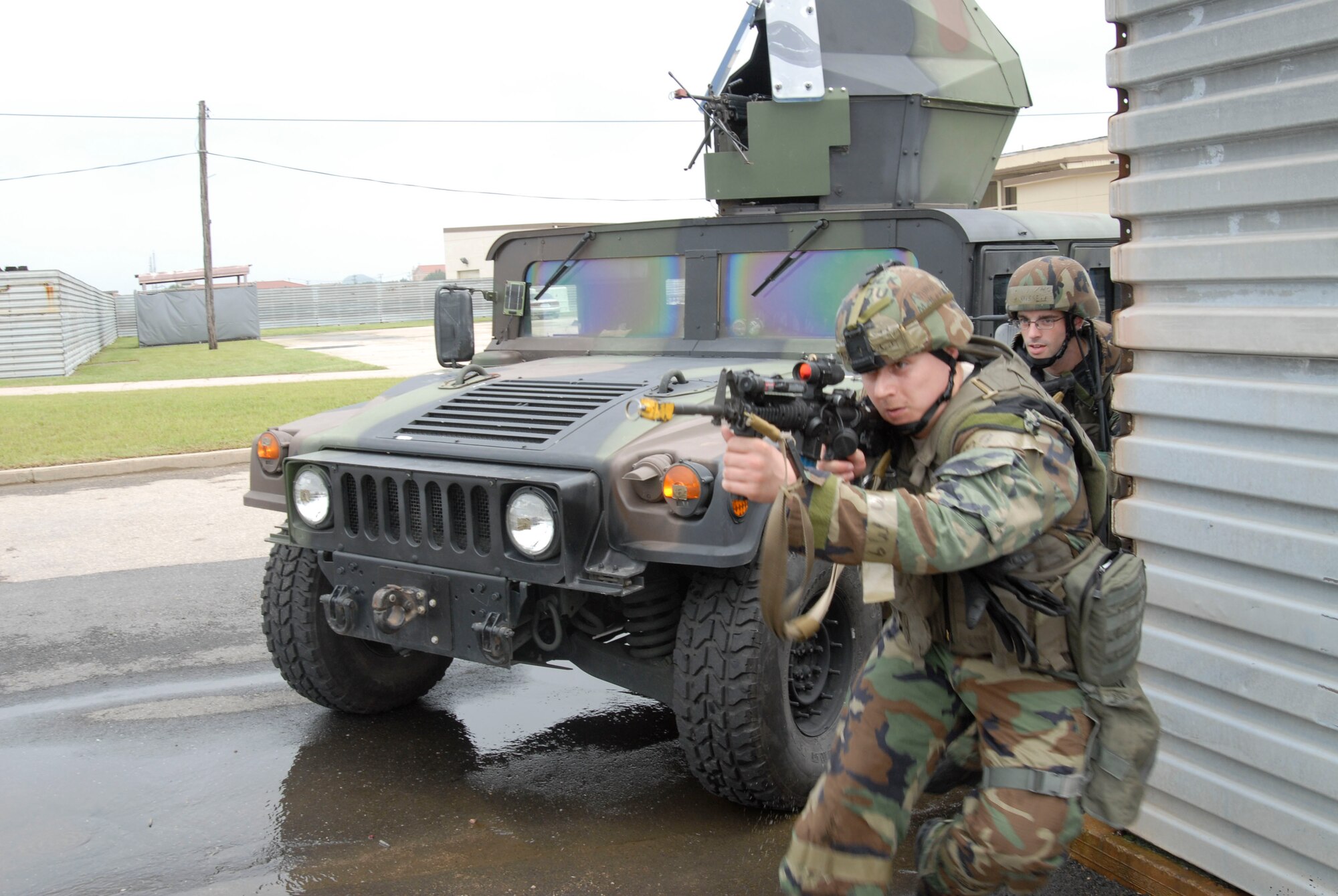 Capt. Andrew Zelechoski and Airman 1st Class Joshua Russell, both assigned to the 8th Security Forces Squadron, respond to a simulated  ground attack to the control tower July 21, at Kunsan Air Base, Republic of Korea. These Airmen are participating in a peninsula wide operational readiness exercise. (U.S. Air Force photo by Staff Sgt. Darnell T. Cannady)