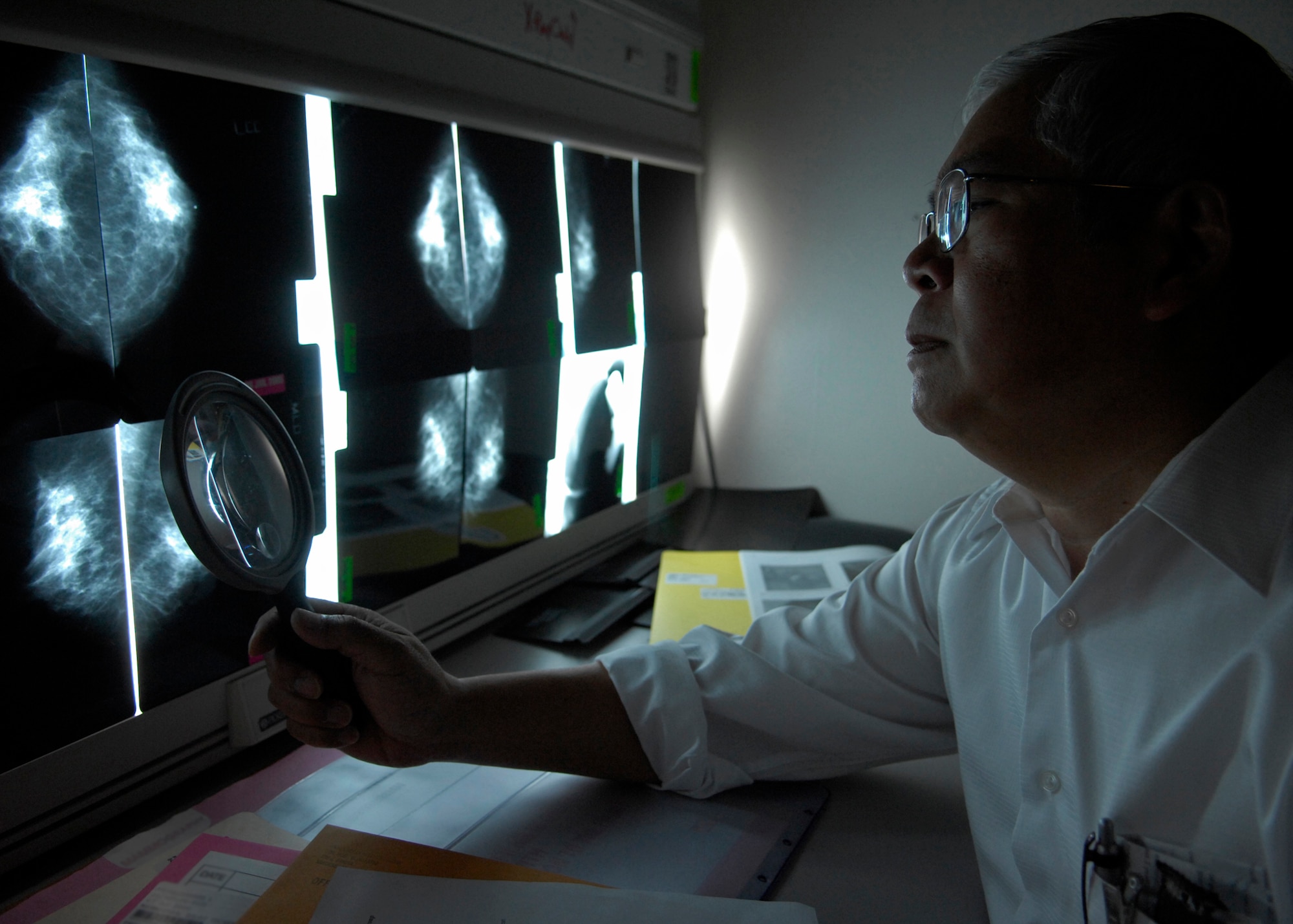 VANDENBERG AIR FORCE BASE, Calif. -- Dr. Franklin Woo, a radiologist of the 30th Medical Support Squadron, reviews a mammogram of a recent patient here July 7. The 30th MDOS keeps Airmen healthy and ready to deploy, so they are ready to support the mission. (U.S. Air Force photo/Airman 1st Class Andrew Lee) 
 
 