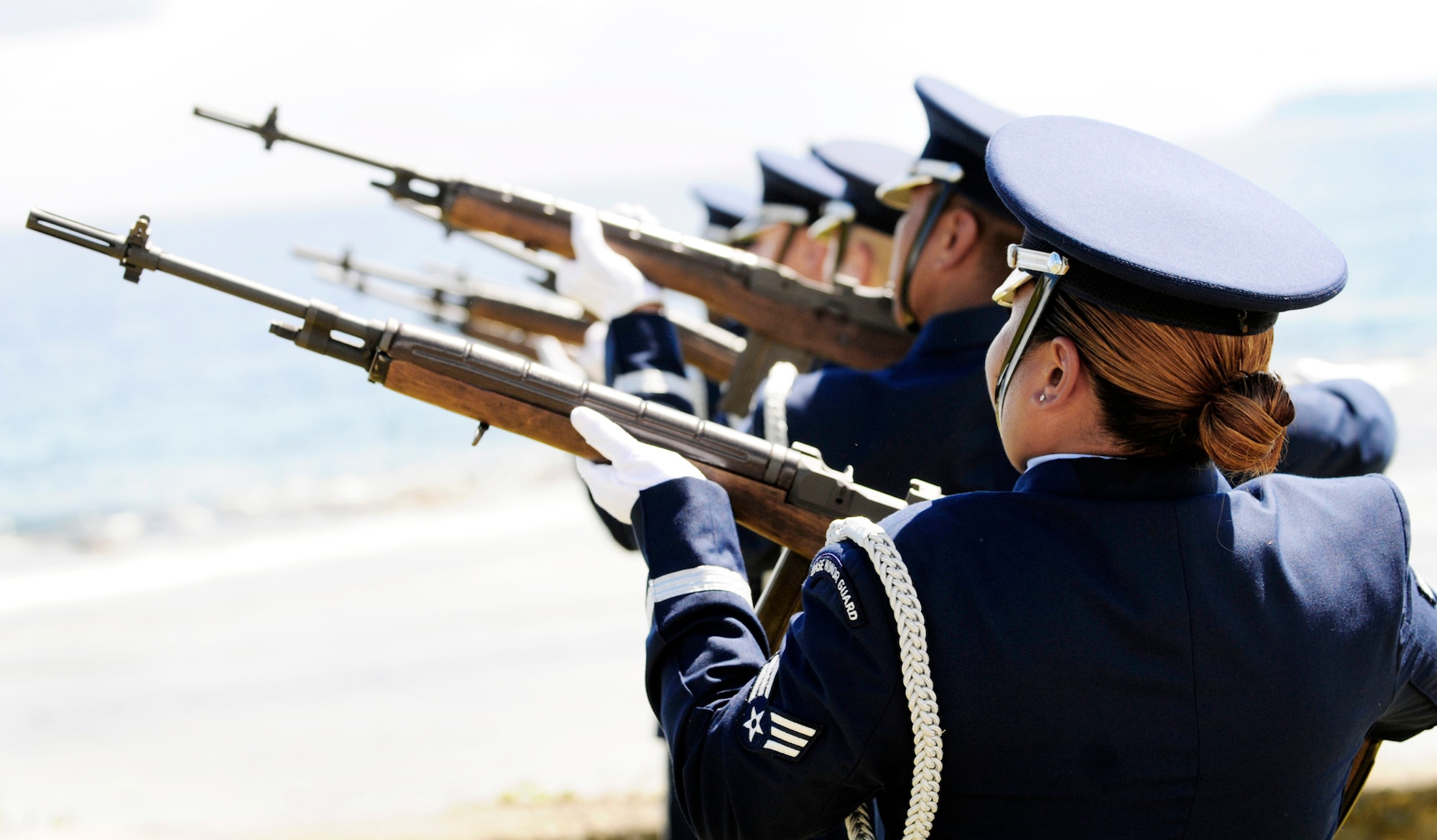 Airmen from the 36th Wing Honor Guard at Andersen Air Force Base, Guam, conduct a 21-gun salute July 20 during the RAIDR 21 Memorial Unveiling Ceremony at the Governor's Complex at Adelup Point in Hagatna, Guam. Family, friends and co-workers of the RAIDR 21 aircrew along with residents of the local Guam community honored the fallen aircrew with the ceremony where a memorial dedicated to the Airmen was unveiled. The aircrew died when their B-52 Stratofortress crashed off the coast of Guam July 21, 2008. (U.S. Air Force photo/Airman 1st Class Courtney Witt)