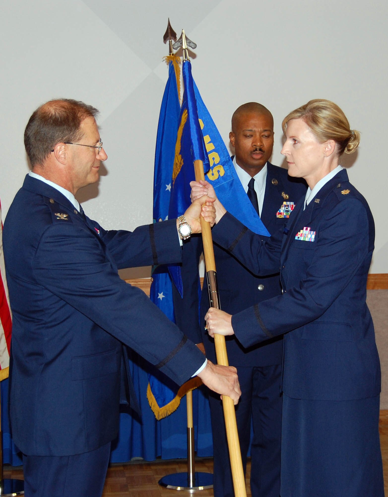 Maj. Amy Boehle, 926th Mission Support Squadron commander, receives the guidon from Col. Herman Brunke, 926th Group commander, during the squadron's assumption of command ceremony July 10. (photo courtesy of 926th Mission Support Squadron)