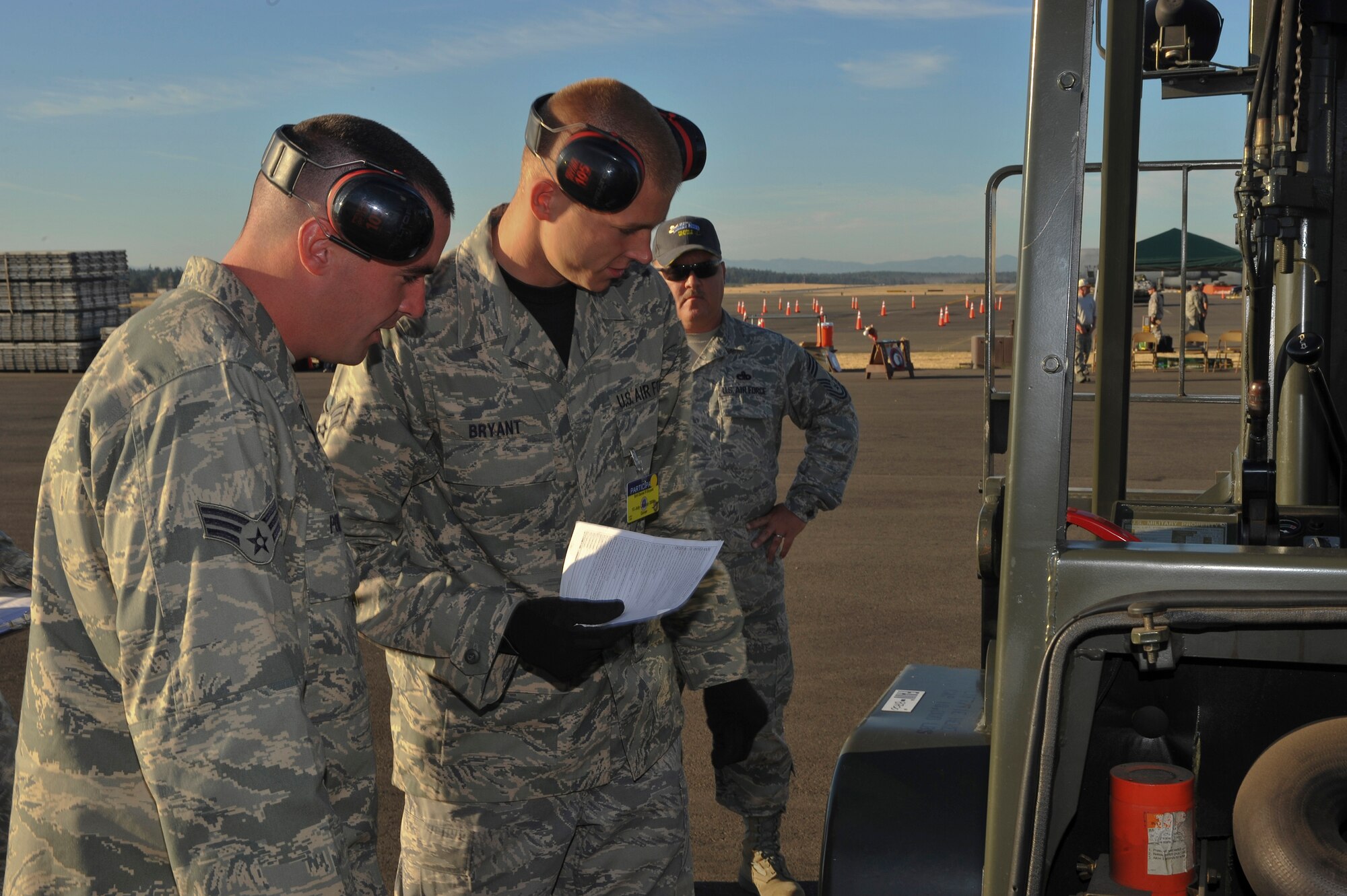 Senior Airmen Jonas Powers and Daniel Bryant perform a pre-inspection on a 10K forklift during an event at Air Mobility RODEO 2009, July 20.  RODEO is an international combat skills and flying operations competition designed to develop and improve techniques and procedures with our international partners to enhance mobility operations.  The competitors are from the 436th Aerial Port Squadron at Dover Air Force Base, Del.  (U.S. Air Force photo by Master Sgt. Joe Springfield/Released)