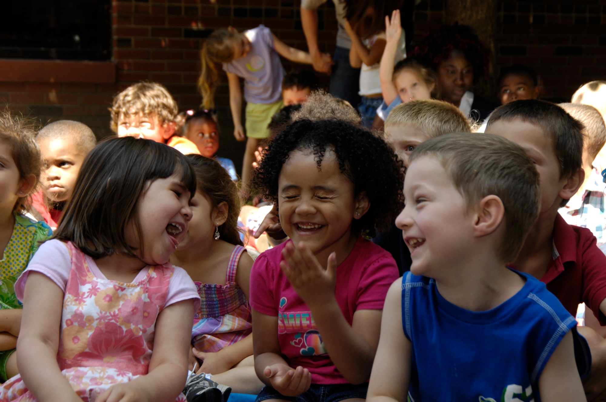 HANSCOM AIR FORCE BASE, Mass. –Children share a laugh during a sing along performance at Hanscom’s CDC on July 14, by local children’s performing artist, Hugh Hanley. (U.S. Air Force photo by Linda LaBonte Britt)