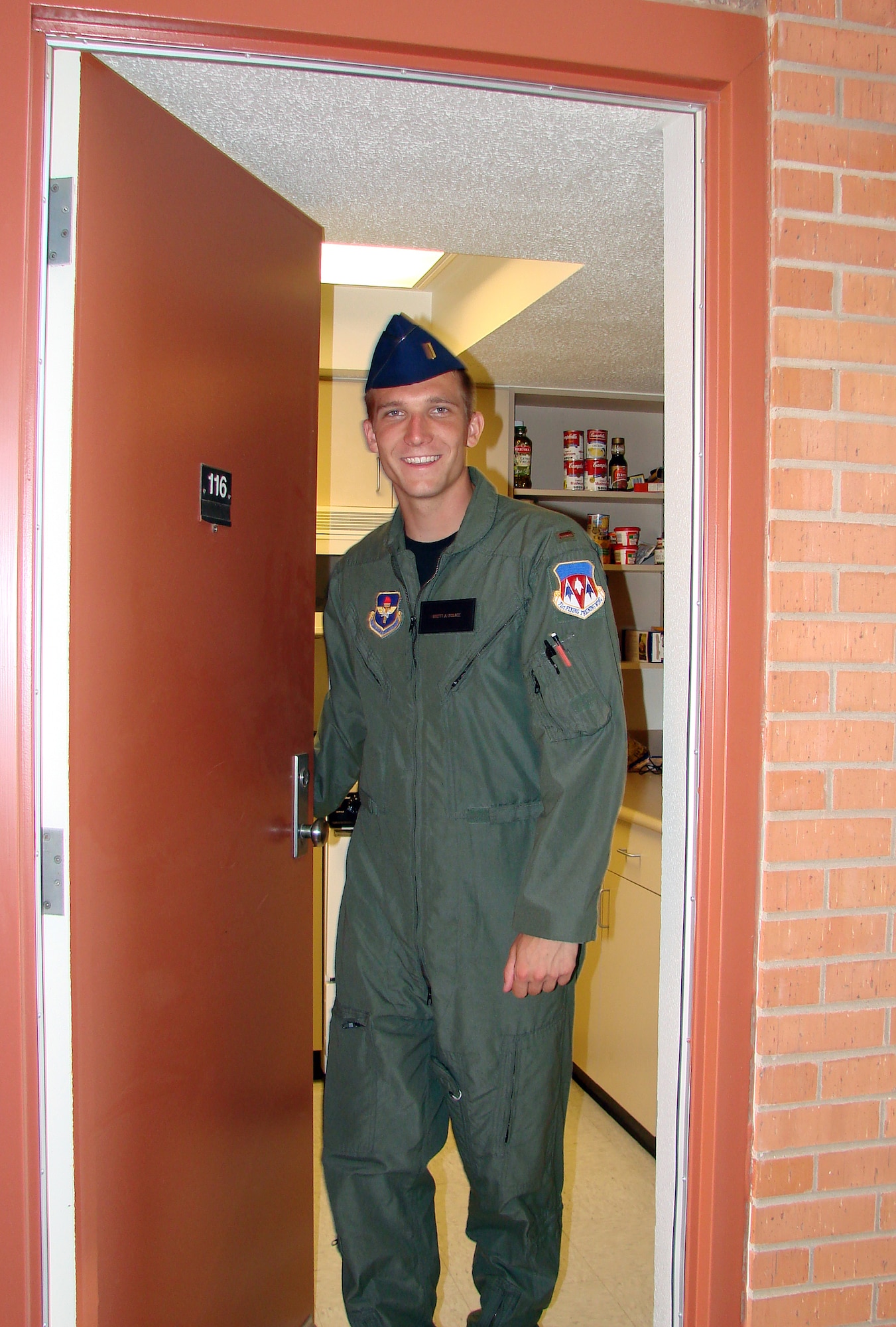 2nd Lt. Brett Polage, a Joint Specialized Undergraduate Pilot Training student in the 8th Flying Training Squadron, exits his dormitory in the unaccompanied officers' quarters on base July 21. (U.S. Air Force photo/ 2nd Lt. Lynn Aird)
