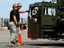 Senior Airman Coban Goertz, 46th Aerial Port Squadron 60K loader driver, gets help from spotters from the 436th Aerial Port Squadron as he backs up while trying to avoid hitting cones July 20. Team Dover aerial porters are participating in the Air Mobility RODEO at McChord Air Force Base, Wash., where they are graded on various exercises aimed at moving cargo and passengers. More than 100 teams are participating in RODEO, including teams from seven foreign countries. The international combat skills and flying operations competition is designed to develop and improve techniques, procedures and enhance mobility operations. (U.S. Air Force photo/Staff Sgt. Steve Lewis)