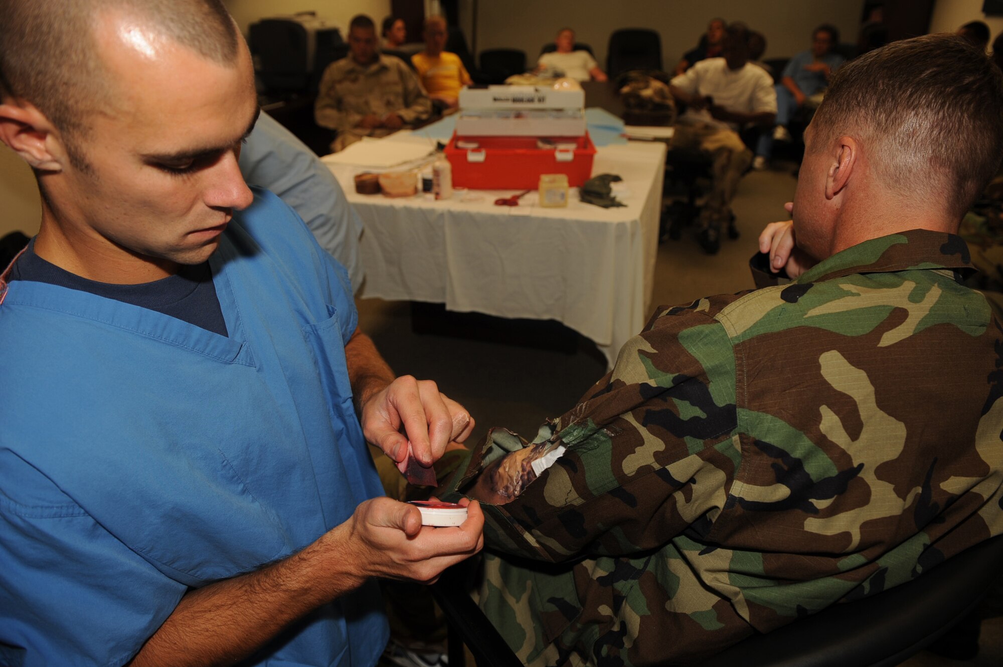 Staff Sgt. Andrew Garrett, 4th Aero Medical Squadron, prepares Master Sgt. Duane Butler, 4th Civil Engineer Squadron firefighter, for an all hazards response training exercise at Seymour Johnson AFB, N.C., July 15, 2009. Sergeant Butler participated in the exercise as a casualty to help train first responders for real life emergencies. (U.S. Air Force photo by Senior Airman Ciara Wymbs)   