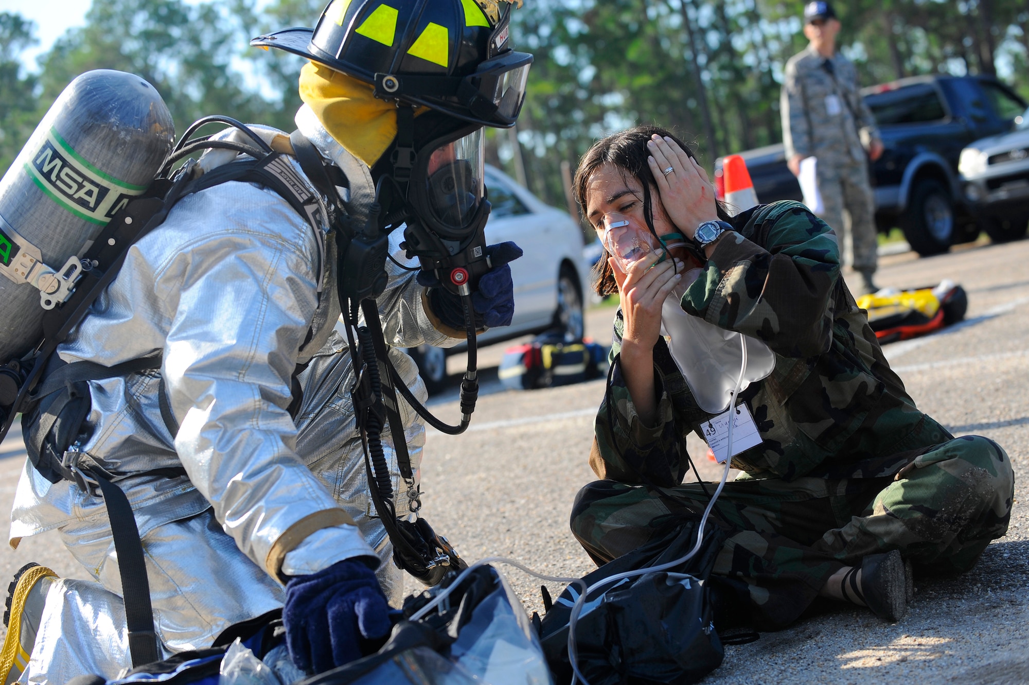 HURLBURT FIELD, Fla. ? A firefighter from the Hurlburt Field fire department administers a non rebreather mask to assist a victim?s breathing during a mass casualty exercise Jul 20. (U.S. Air Force photo/Senior Airman Jason Epley)
