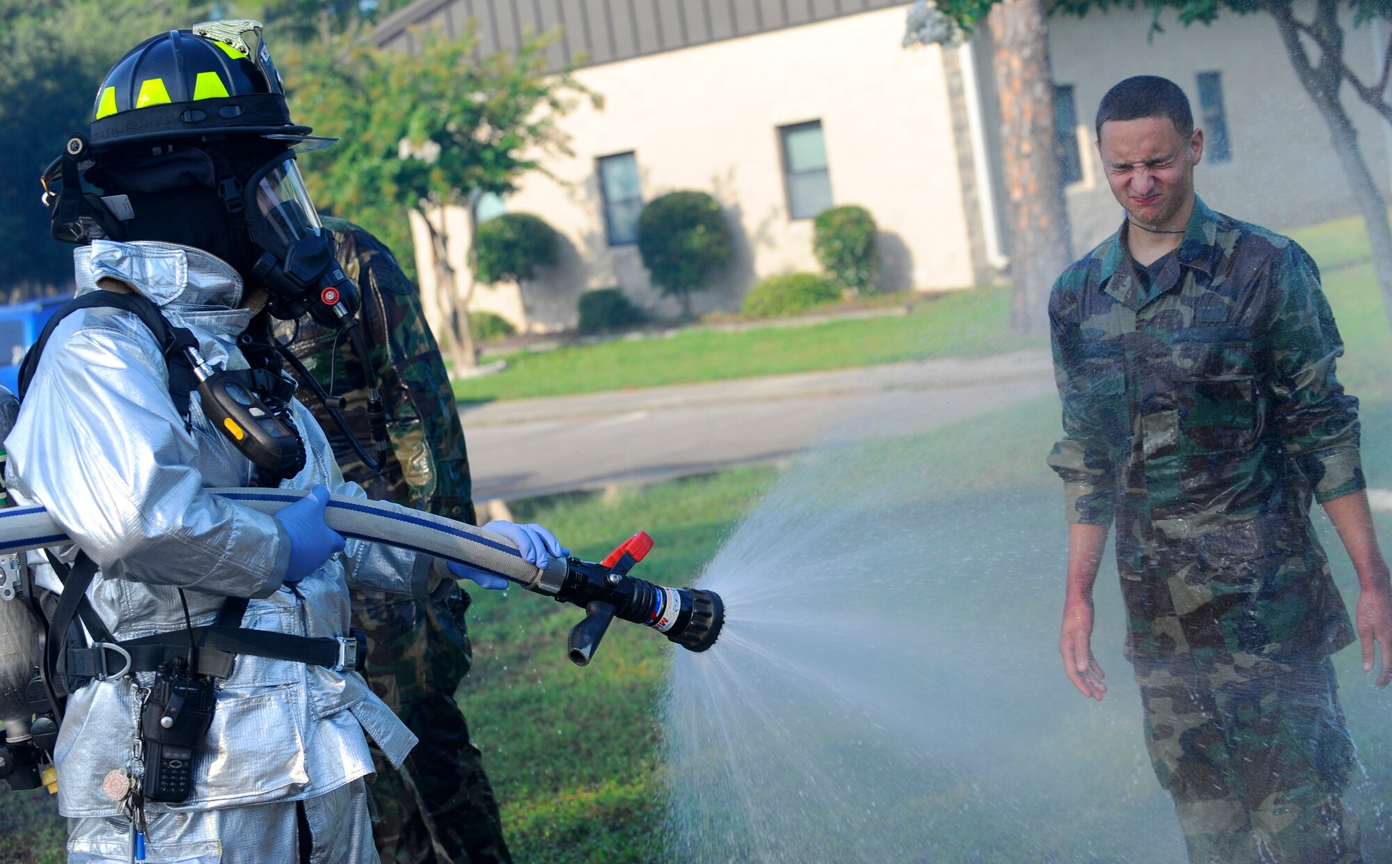 HURLBURT FIELD, Fla. ? A firefighter from the Hurlburt Field fire department sprays a victim during a mass casualty exercise Jul 20.The spray decontaminates victims from hazardous materials. (U.S. Air Force photo/Senior Airman Jason Epley)