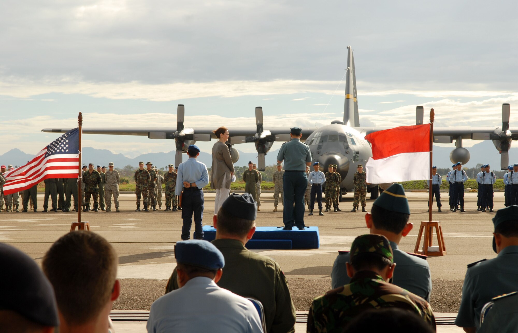 EL TARI AIR FORCE BASE, Indonesia – U.S. Consul General Surabaya Caryn McClelland and Indonesian Col. Budhi Riswanto preside over the Operation Pacific Angel 2009 closing ceremony for Indonesia here July 20. Both Indonesian and U.S. Pacific Angel participants stood together in formation during the ceremony, signifying the combined effort of the two countries.  More than 4,500 patients were seen in the Pacific Angel clinic in Indonesia, and numerous others helped through various civil engineering projects, since the operation began July 16. Pacific Angel is a Pacific Air Forces humanitarian and civic assistance program conducted in the Asia-Pacific region and led by 13th Air Force at Hickam Air Force Base, Hawaii. (U.S. Air Force photo/Senior Master Sgt. Russell Dodson)