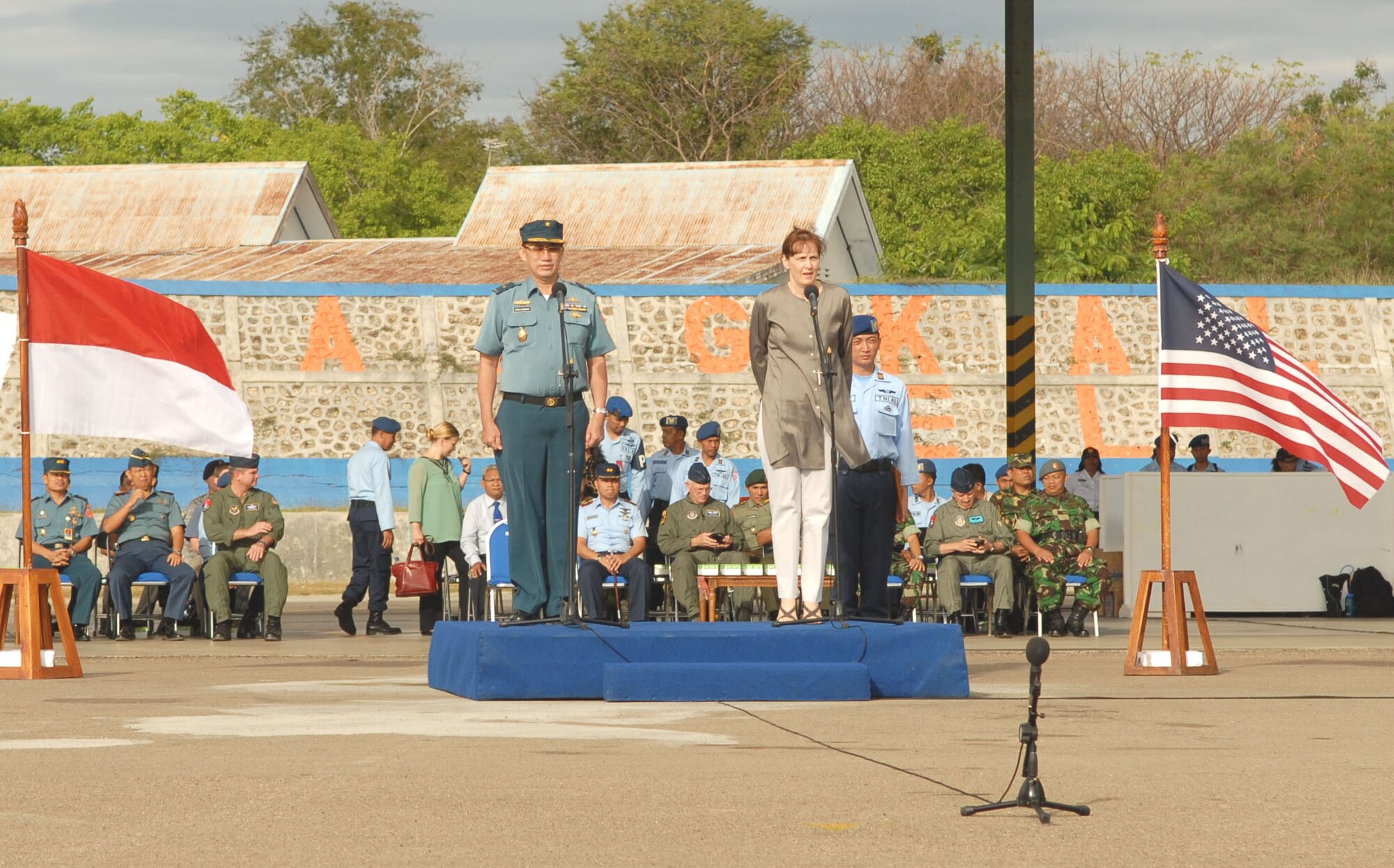 EL TARI AIR FORCE BASE, Indonesia – U.S. Consul General Surabaya Caryn McClelland and Indonesian Col. Budhi Riswanto preside over the Operation Pacific Angel 2009 closing ceremony for Indonesia here July 20. Both Indonesian and U.S. Pacific Angel participants stood together in formation during the ceremony, signifying the combined effort of the two countries.  More than 4,500 patients were seen in the Pacific Angel clinic in Indonesia, and numerous others helped through various civil engineering projects, since the operation began July 16. Pacific Angel is a Pacific Air Forces humanitarian and civic assistance program conducted in the Asia-Pacific region and led by 13th Air Force at Hickam Air Force Base, Hawaii. (U.S. Air Force photo/Senior Master Sgt. Russell Dodson)