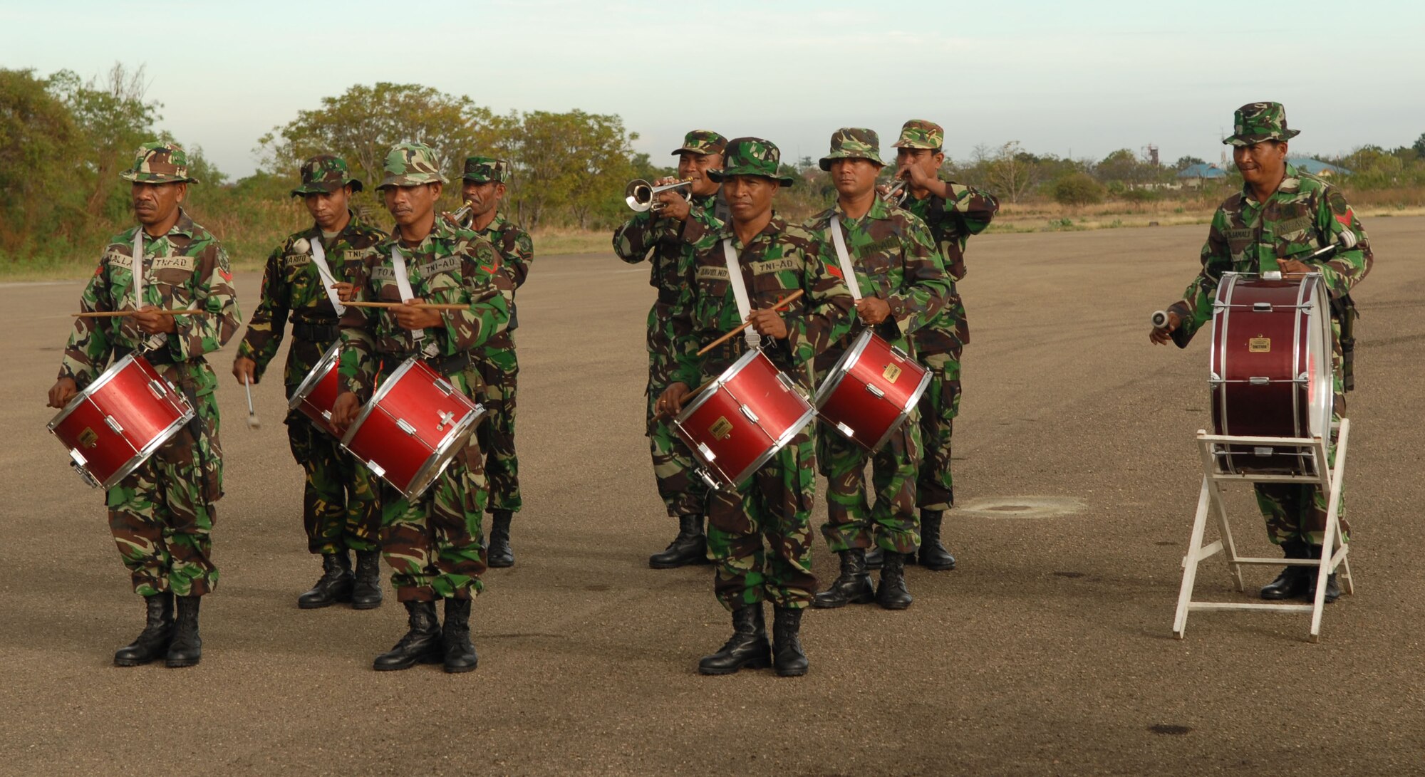 EL TARI AIR FORCE BASE, Indonesia – Members of the Indonesian military’s band perform during the Operation Pacific Angel 2009 closing ceremony for Indonesia here July 20. Both Indonesian and U.S. Pacific Angel participants stood together in formation during the ceremony, signifying the combined effort of the two countries.  More than 4,500 patients were seen in the Pacific Angel clinic in Indonesia, and numerous others helped through various civil engineering projects, since the operation began July 16. Pacific Angel is a Pacific Air Forces humanitarian and civic assistance program conducted in the Asia-Pacific region and led by 13th Air Force at Hickam Air Force Base, Hawaii. (U.S. Air Force photo/Senior Master Sgt. Russell Dodson)