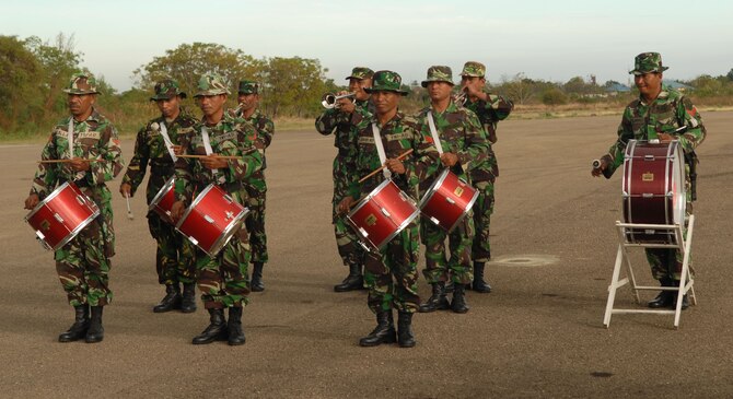 EL TARI AIR FORCE BASE, Indonesia – Members of the Indonesian military’s band perform during the Operation Pacific Angel 2009 closing ceremony for Indonesia here July 20. Both Indonesian and U.S. Pacific Angel participants stood together in formation during the ceremony, signifying the combined effort of the two countries. Thousands of patients were seen in Pacific Angel clinics in Indonesia, and numerous others helped through various civil engineering projects, since the operation began July 16. Pacific Angel is a Pacific Air Forces humanitarian and civic assistance program conducted in the Asia-Pacific region and led by 13th Air Force at Hickam Air Force Base, Hawaii. (U.S. Air Force photo/Senior Master Sgt. Russell Dodson) 